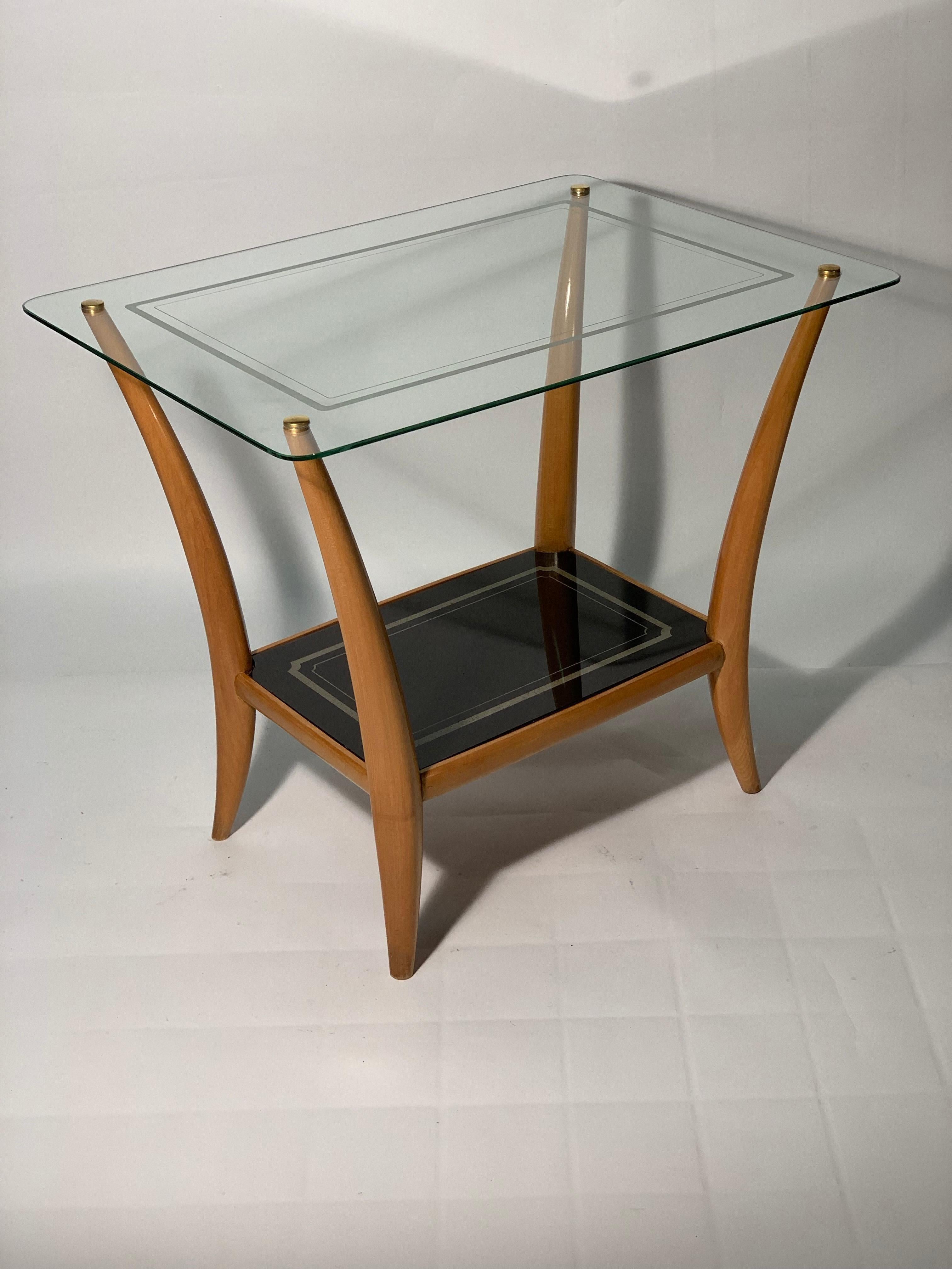 Midcentury Italian four solid maples sculptured legs and two beveled and profiled glass tops with a sanded decoration, the top below in black glass, the top above transparent.
Italy, 1940s.
 