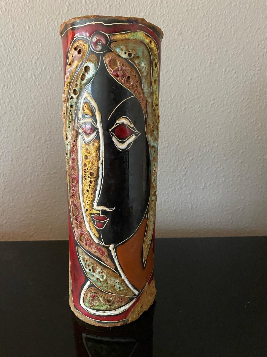 By Marcello Fantoni, a beautiful vase with two figures outlined in rough fat lava with sgraffito and filled with glossy, multicolored glazes.