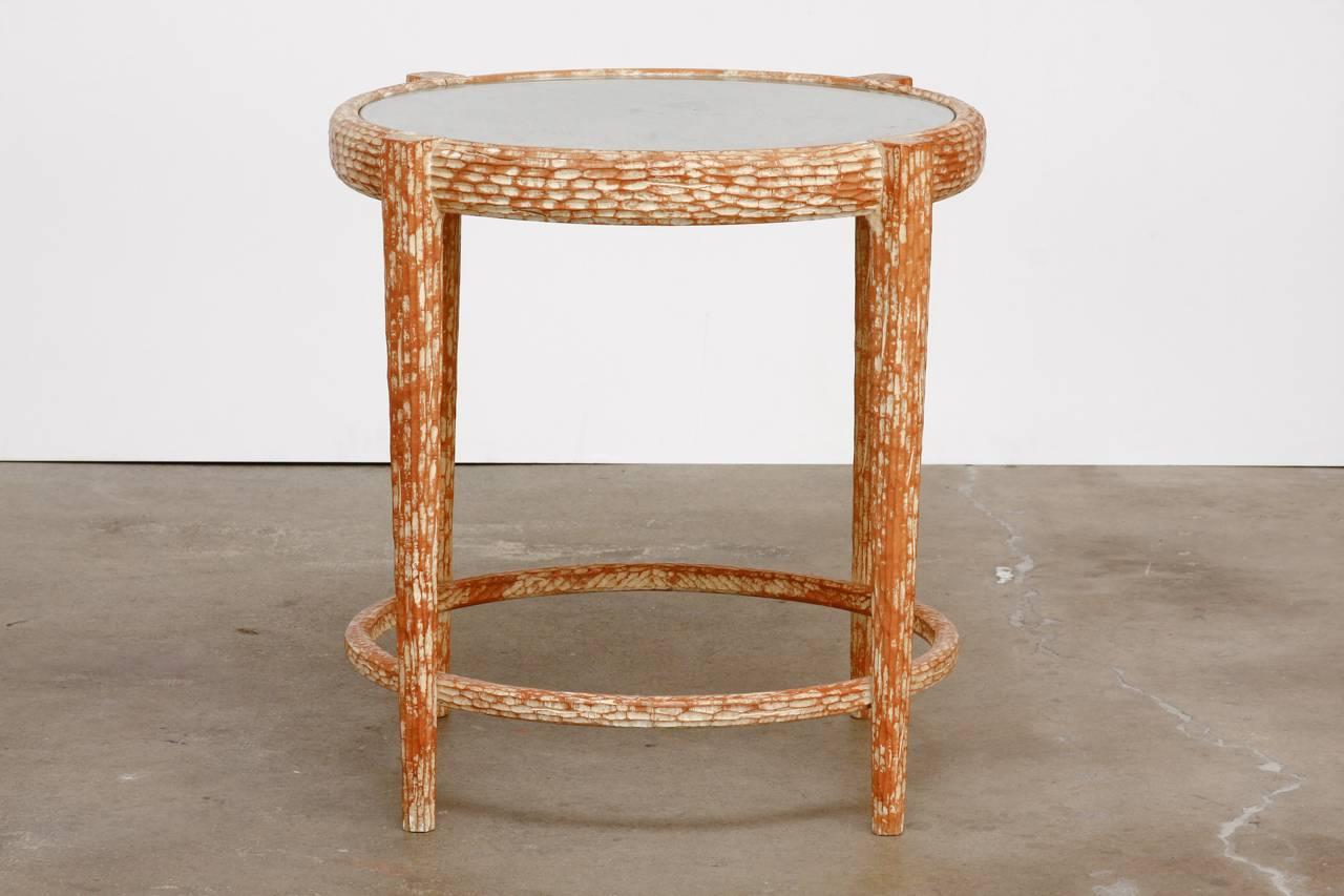 Stunning midcentury Italian occasional table featuring a carved faux bois decoration with a cerused style of finish on the wood. The top of the table has a rustic woven rush caning topped with a round pane of glass that fits flush. The table is
