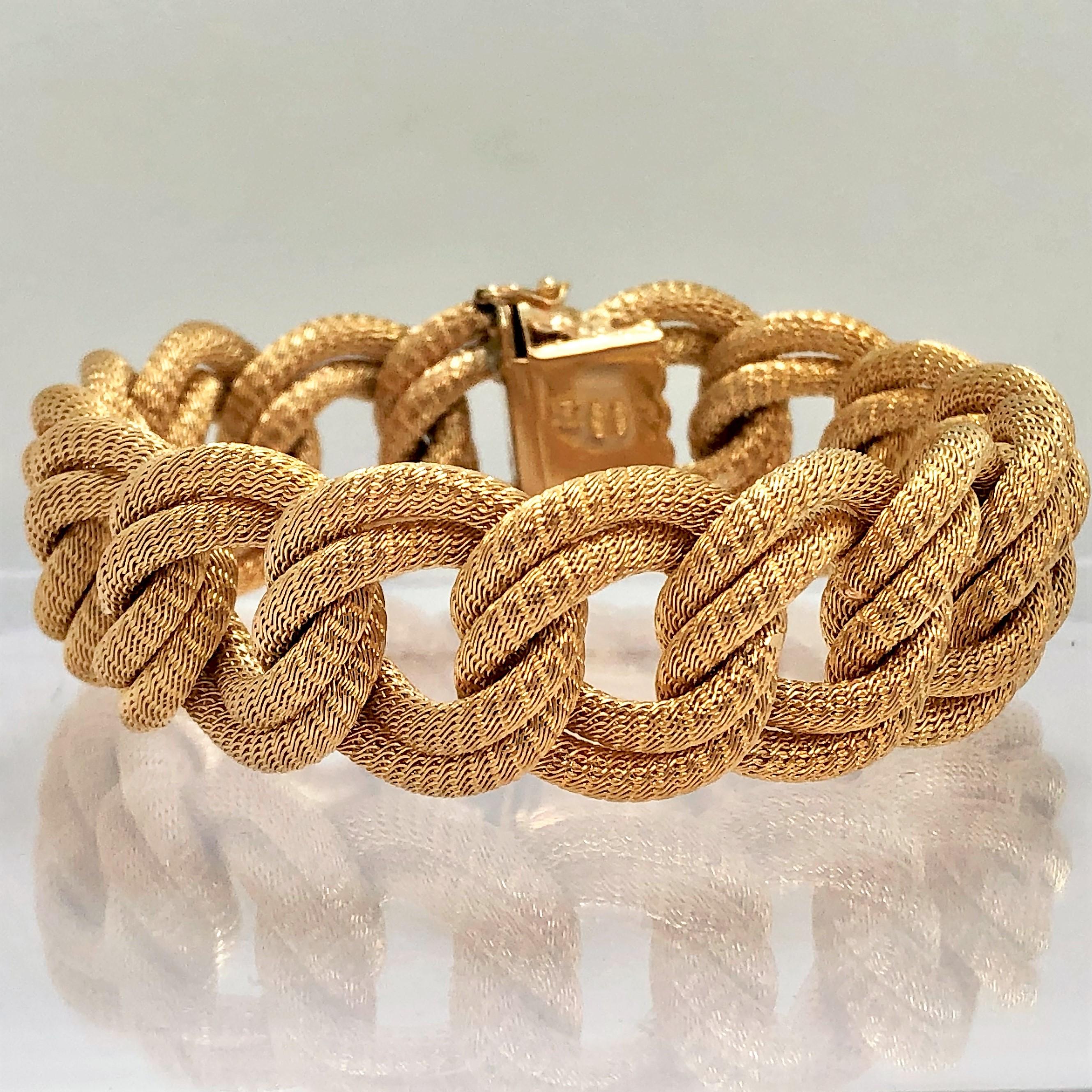 Made in the Verona region of Italy during the 1960's-1970's, this classic 
18K Yellow Gold, woven mesh link bracelet is both graceful and elegant. 
This is a fine example of the Italian gold weaving art.
Measuring a full 7 1/2 inches long by just