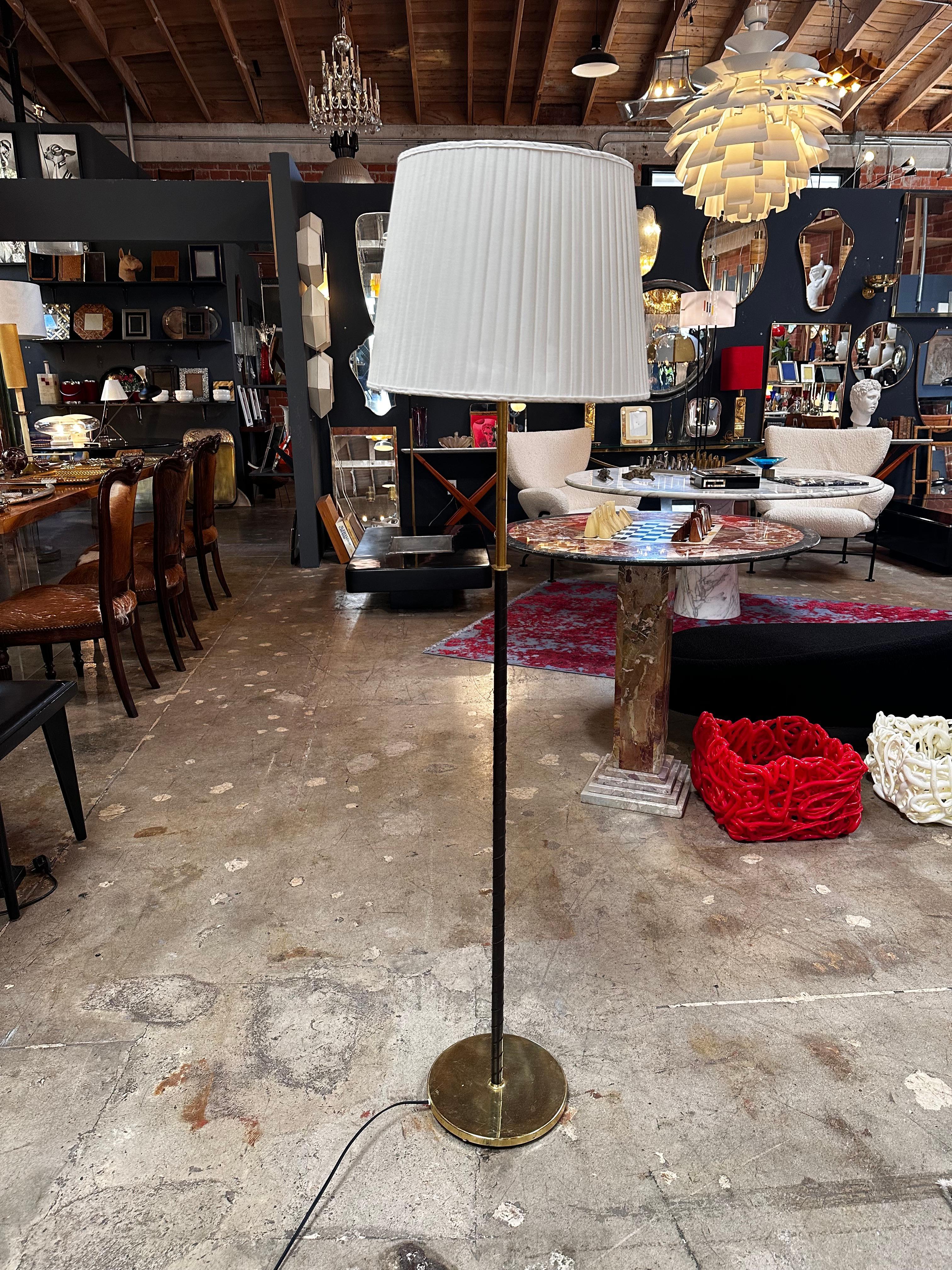 The Mid Century Italian Floor Lamp from the 1980s is a stylish lighting fixture that reflects the design sensibilities of the era. Characterized by its sleek lines and minimalistic design, this floor lamp typically features a blend of materials,