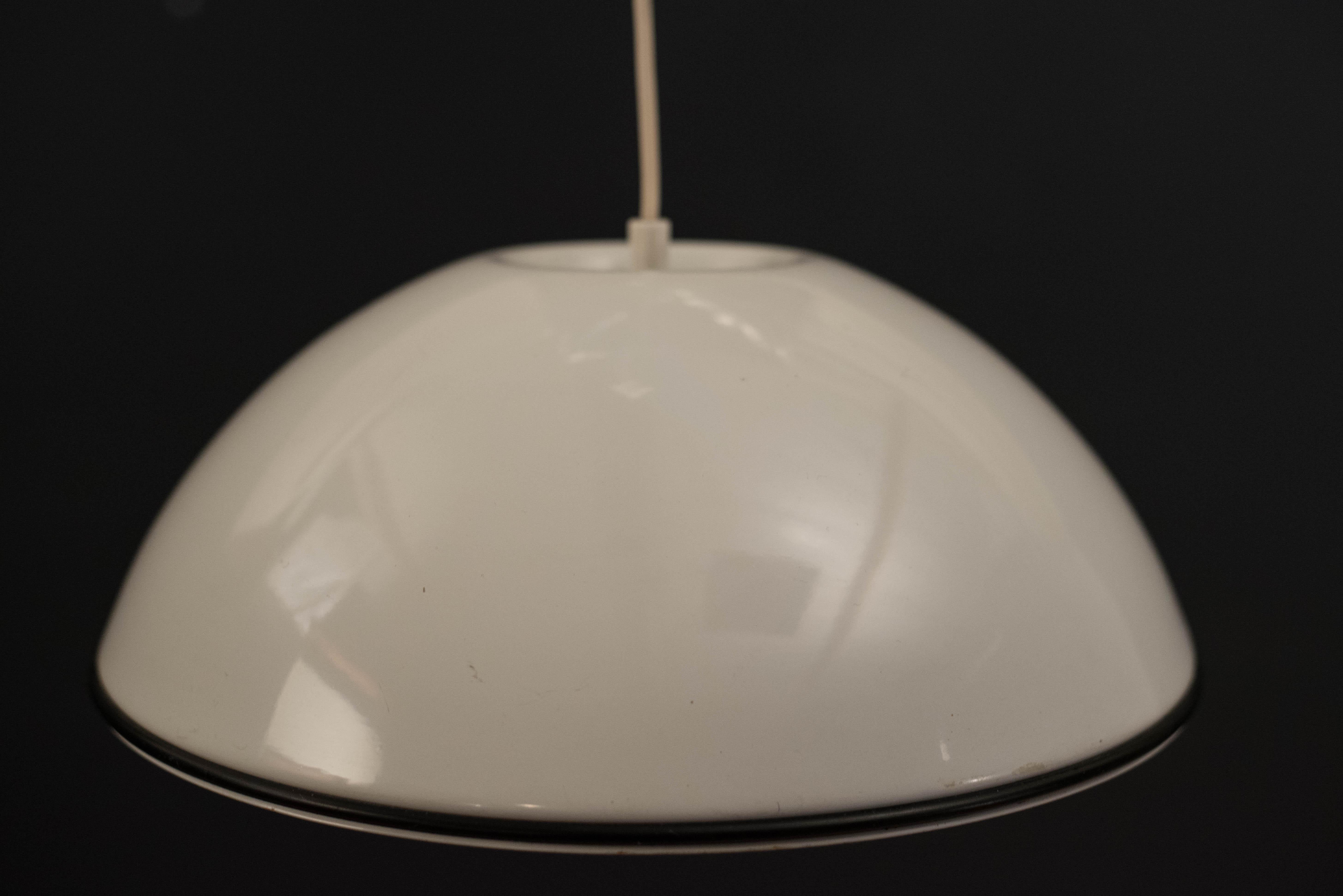 Vintage Relemme hanging pendant lamp designed by Achille and Pier Giacomo Castiglioni for Flos. This piece has a white enamel finish with black rubber trim. Counterbalance pulley is adjustable to your desired height.