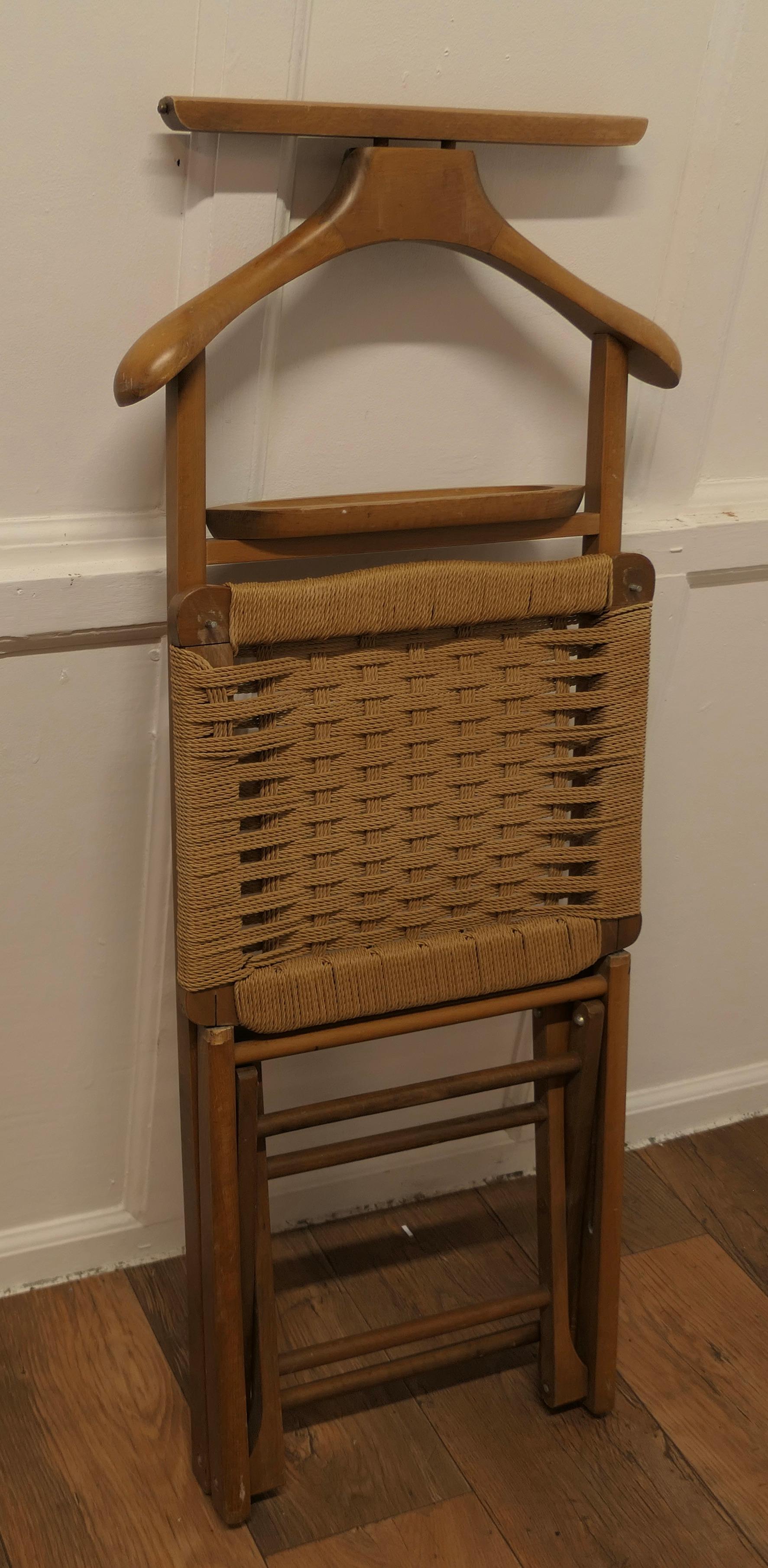 Midcentury Italian Gentleman’s Floor Standing Valet Luggage Rack.


A very useful piece, the Valet or clothes stand/Luggage rack is made in beech with a Woven Seagrass Seat which doubles up as a Luggage Rack with a coat hanger an trouser