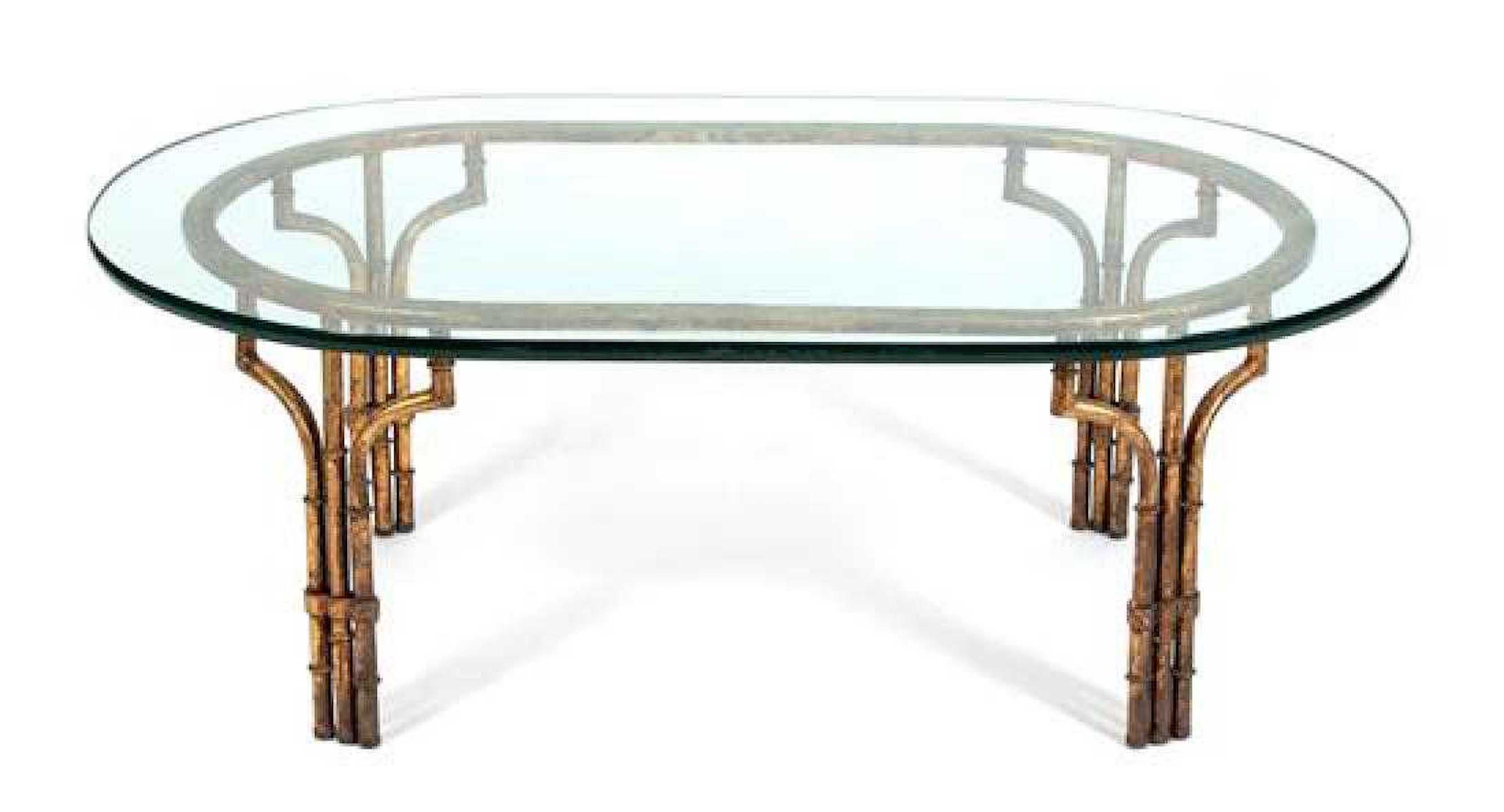 Midcentury Italian gilt metal faux- bamboo glass top coffee table
With thick oval glass top on conforming base.
   
