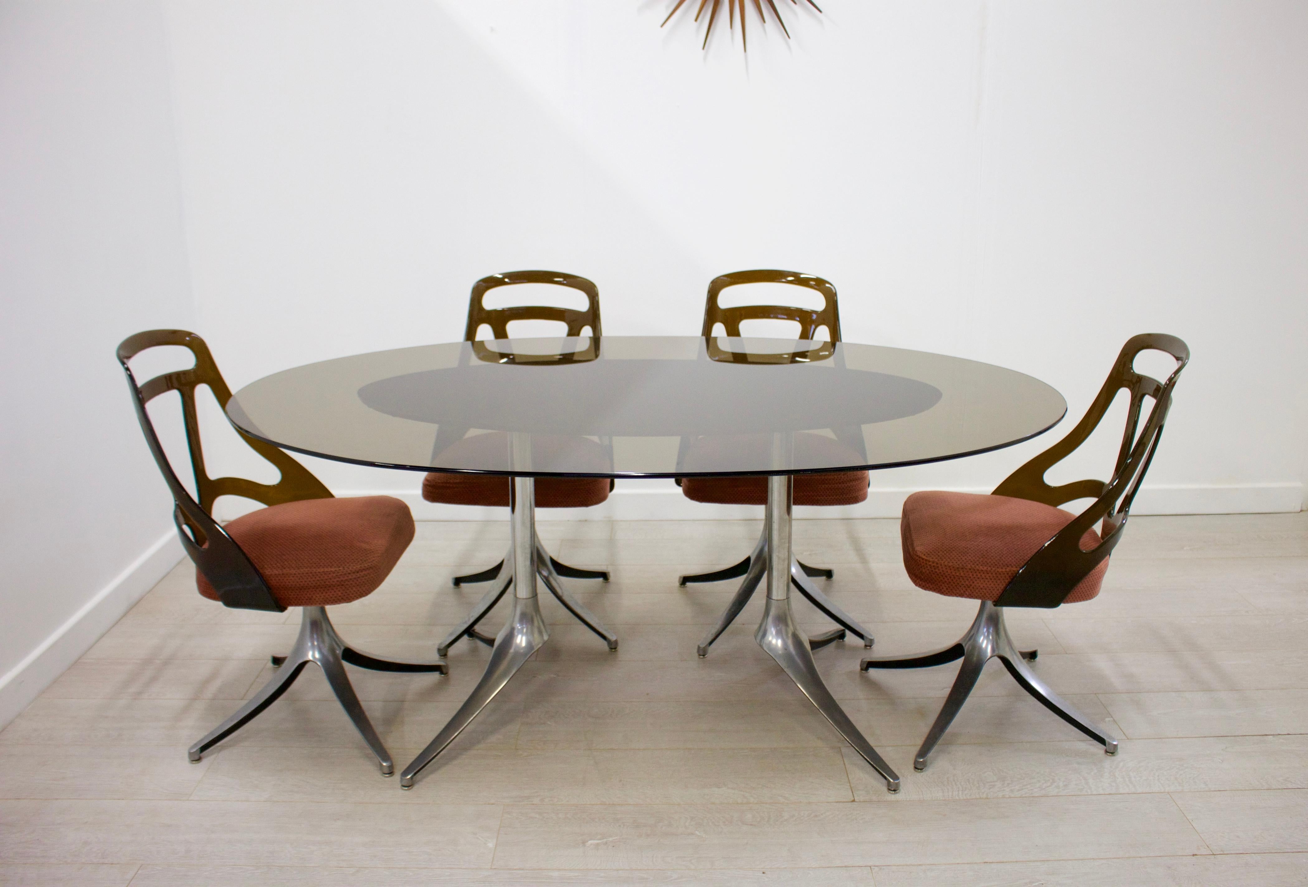 Midcentury dining table and chair set
Made in Italy
Featuring a smoked glass dining tabletop and aluminum legs
Chair dimensions:
Height 83cm (Seat height 45cm), width 44cm, depth 43cm.