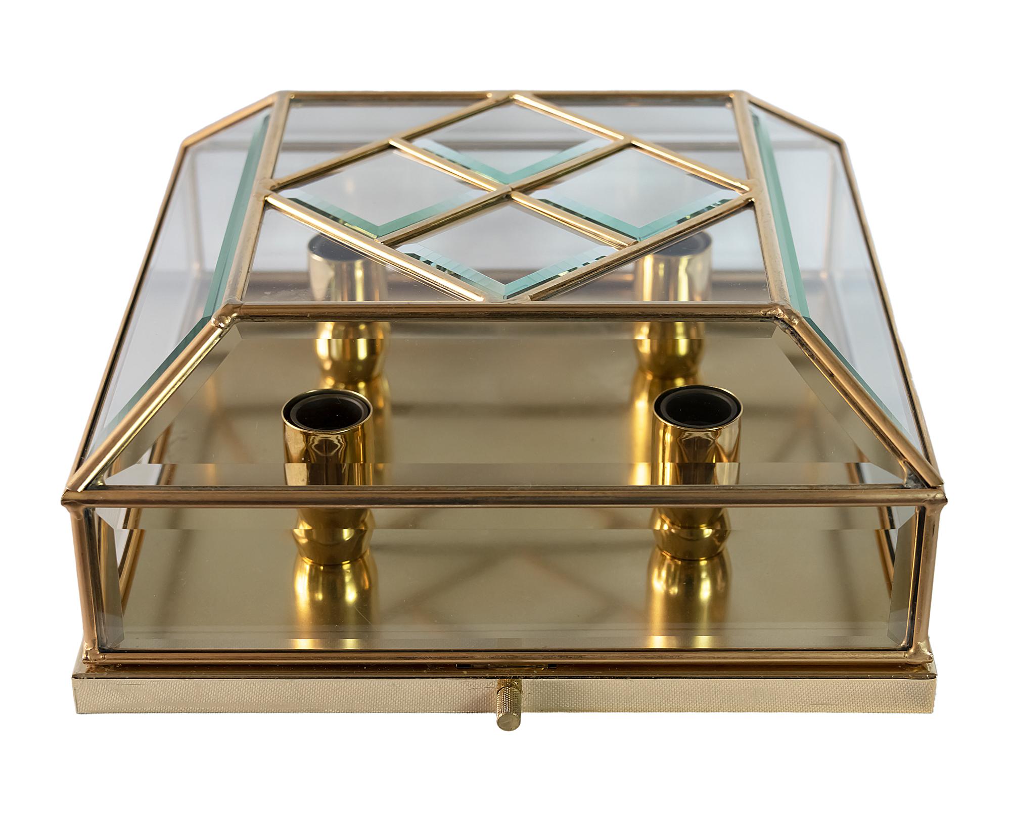 Italian mid-century flush mount chandelier is made of rectangular gold-plated metal base with faceted glass in the frames.
This chandelier includes 4 pcs. E14 bulbs.
It is in a very good original vintage condition.

 