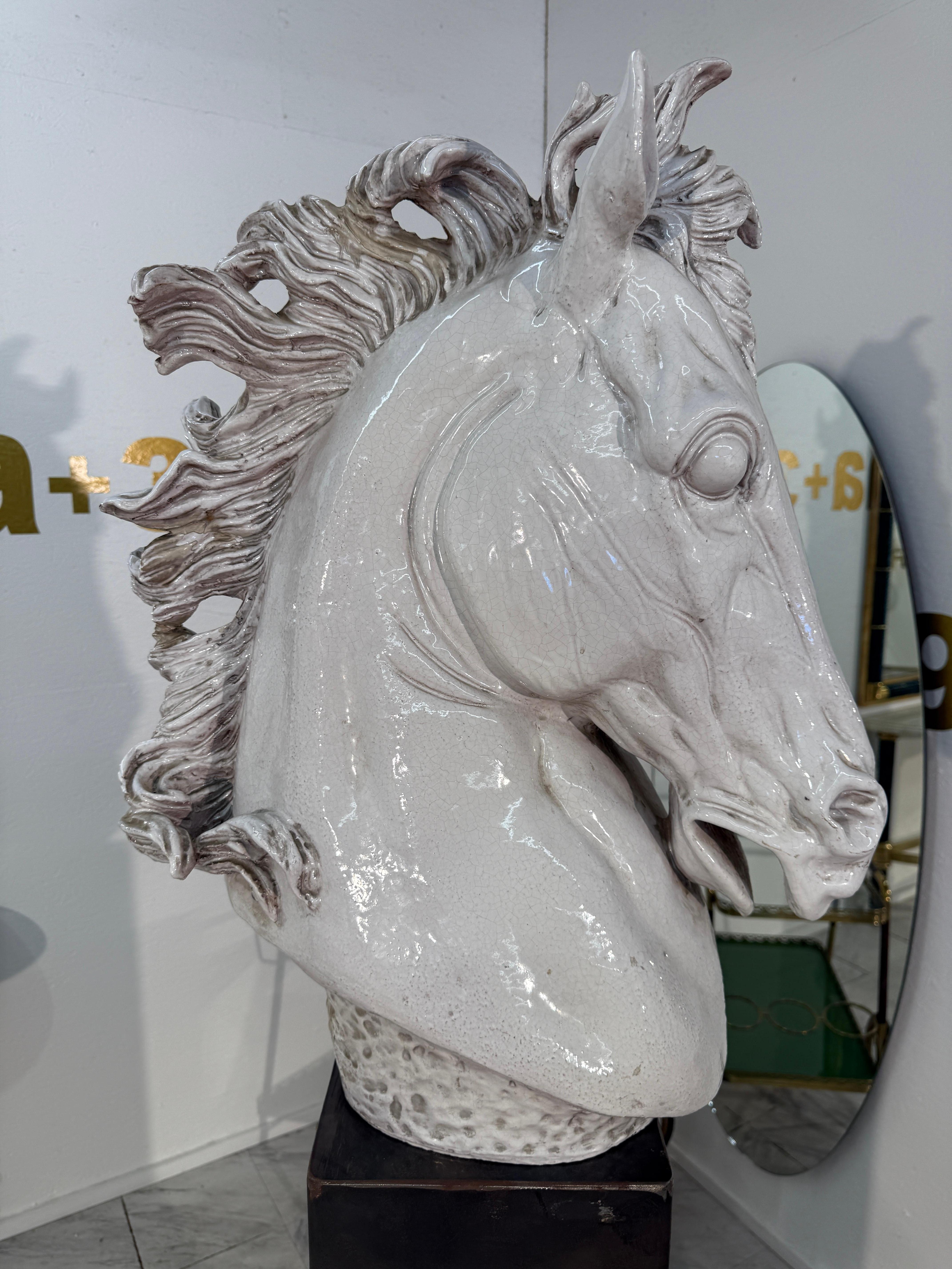 This ceramic bust captures the vitality and spirit of the horse in motion, its sculptural form echoing the elegance of classical equestrian art. Elegantly crafted in Italy during the mid-20th century, the piece is finished in a glossy ivory glaze