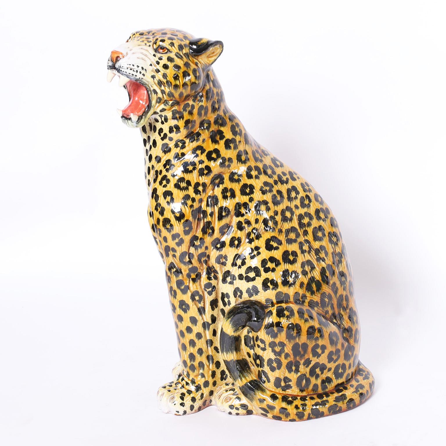 Vintage Italian leopard sculpture or statue crafted in terra cotta, decorated and glazed in a rather ferocious pose.