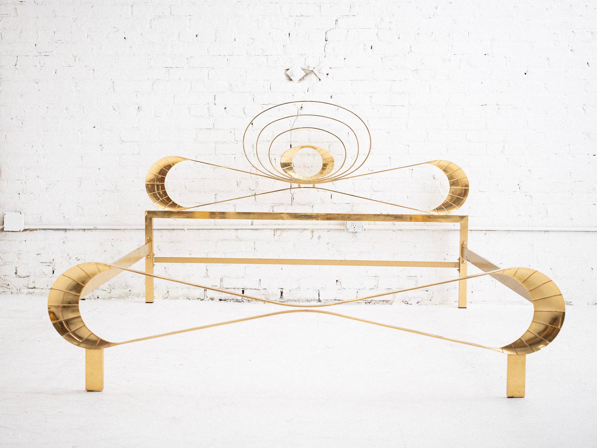A mid century Italian bed frame. Gold tone metal in a glamorous Hollywood Regency silhouette. Will be disassembled for transport. Sourced in Northern Italy.

Area to fit mattress measures 77” long, 67” wide.