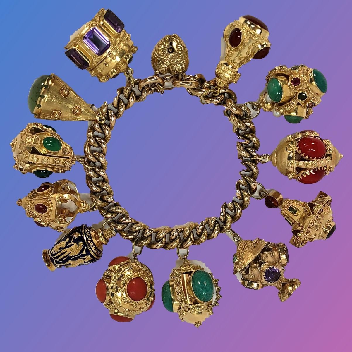 A beautiful vintage 18K Yellow Gold bracelet with both smooth and textured 11/32 inch wide links sporting 12 beautiful, Italian gold Estruscan Revival charms. One of the charms is a blue enamel perfumier, and the other 11 charms are set with various