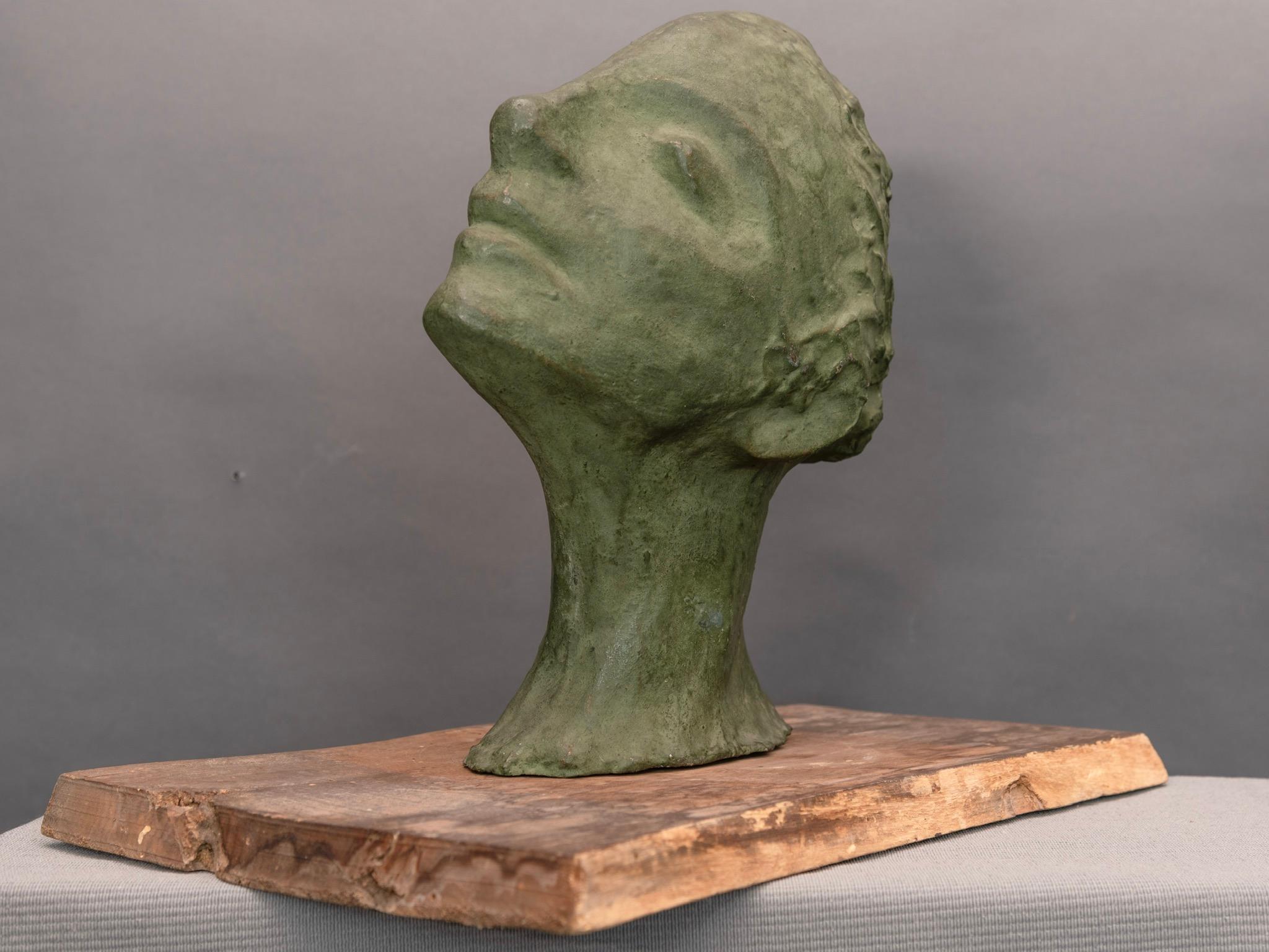 Plaster sculpture depicting a lovely young woman. 
Original wood base.
Ida Fua is a Jewish artist, lived during the years of fascism and racial laws; Ida Fua is an invisible artist, a woman who had to hide herself with her own art. Coming from the