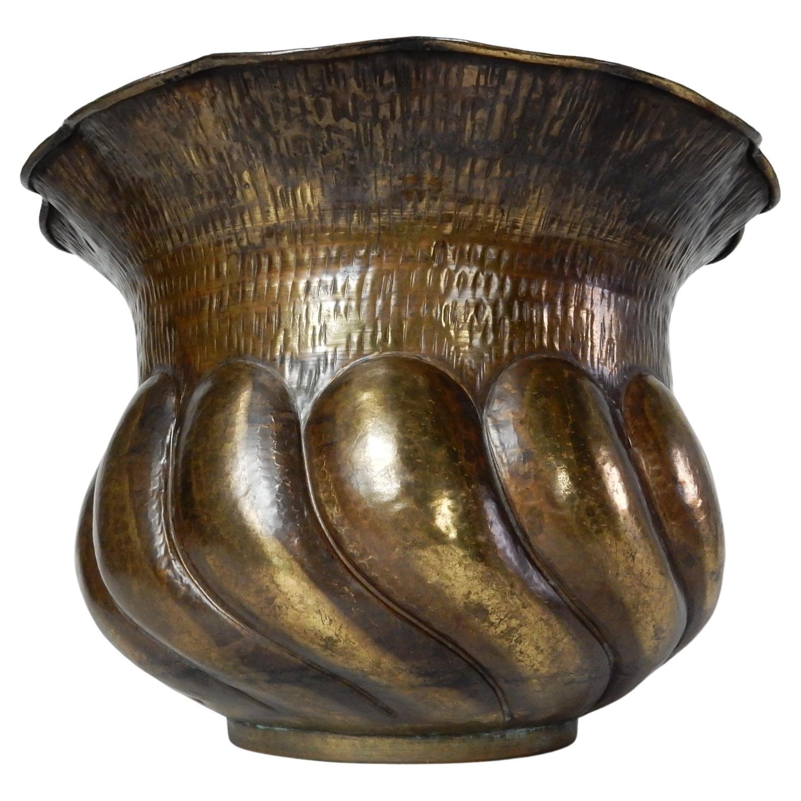 Egidio Casagrande attributed hammered copper / brass jardinière pot.
Hand made in Italy, circa 1950's.
Warm aged patina throughout.
Large piece measuring 21in wide and 14in tall. 
Smallest inside width is 14-1/2in.
No holes or issues.
 