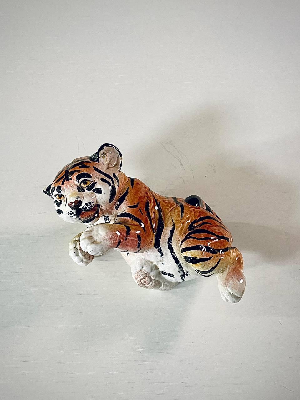 Condition: Original Vintage Condition

Designer: Signed Italy
Manufacturer: Signed Italy
Materials: Hand Painted Glazed Ceramic

This exquisite hand-painted Italian ceramic tiger cub showcases the rich artistry of mid-century majolica, with lifelike