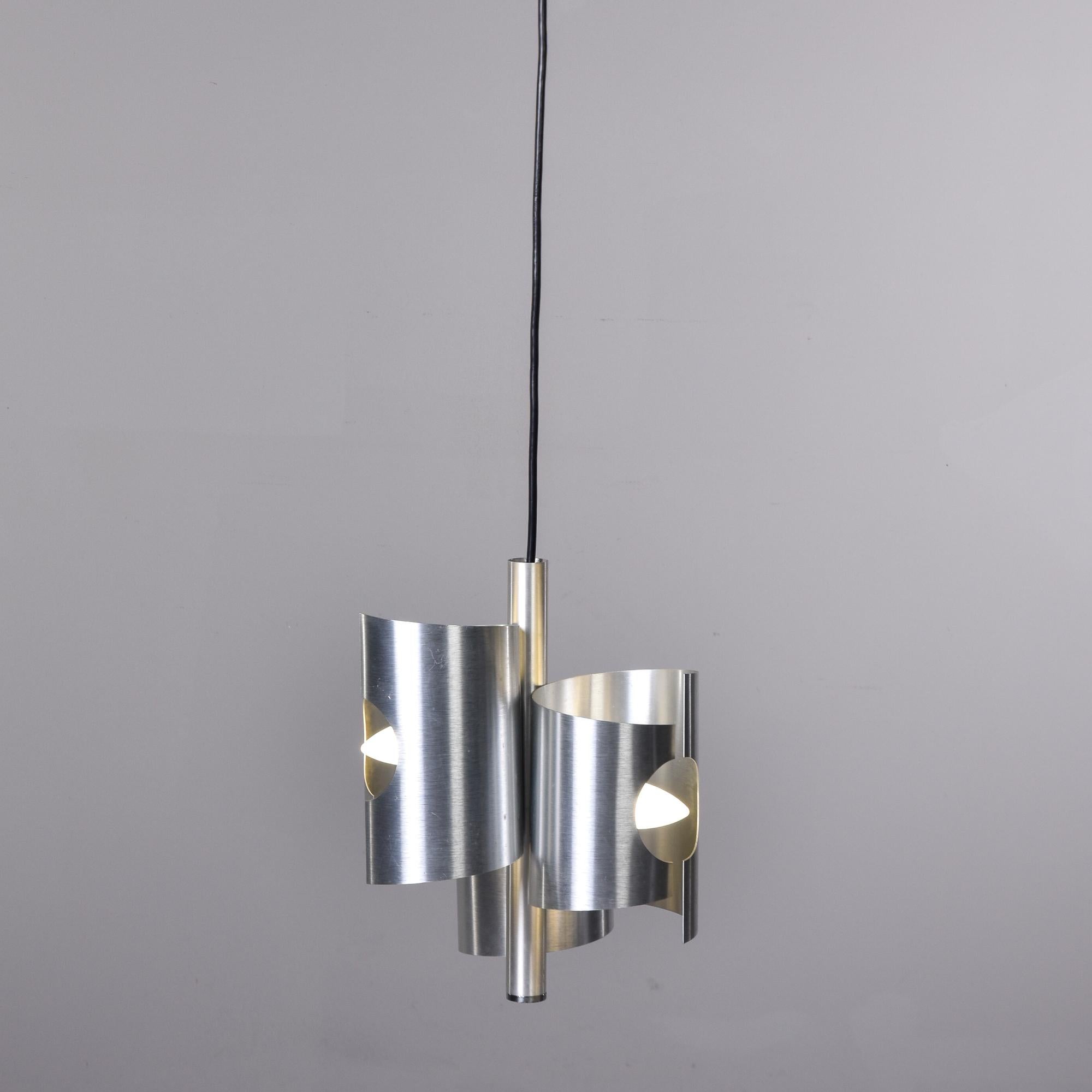 Found in Italy, this circa 1960s hanging pendant has three staggered aluminum tubes with cut outs for the bulbs. Standard sized sockets. Fixture has been rewired for US electrical standards. Larger pendant in same style also available. Unknown