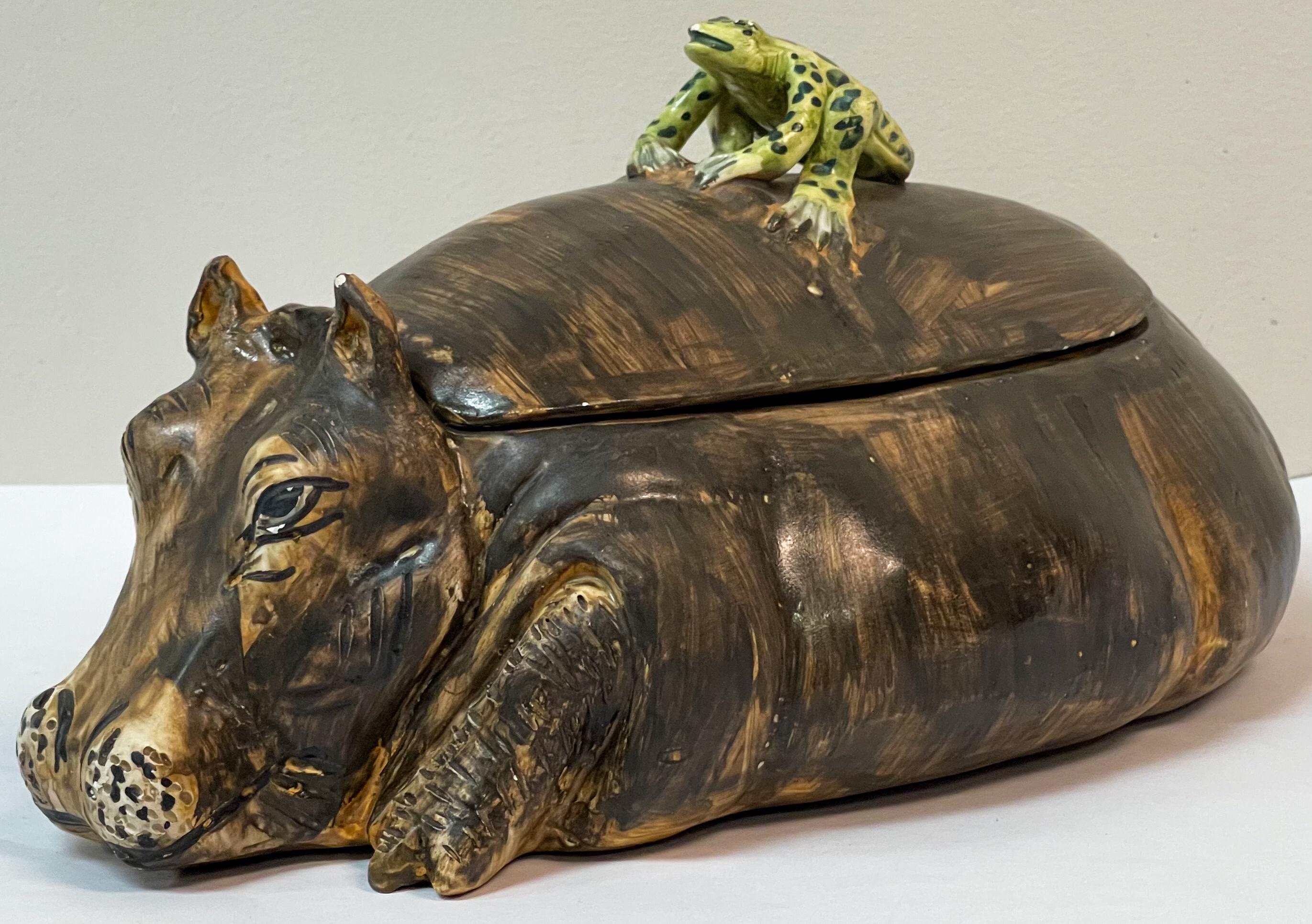 This is so fun for the holidays! It is a signed Italian hippo tureen with a small frog perched on it. It is on very good condition. The markings are an AG plus a coronet.