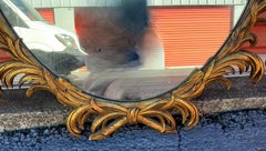 Mid-Century Italian Hollywood Regency Carved Giltwood Oval Mirror