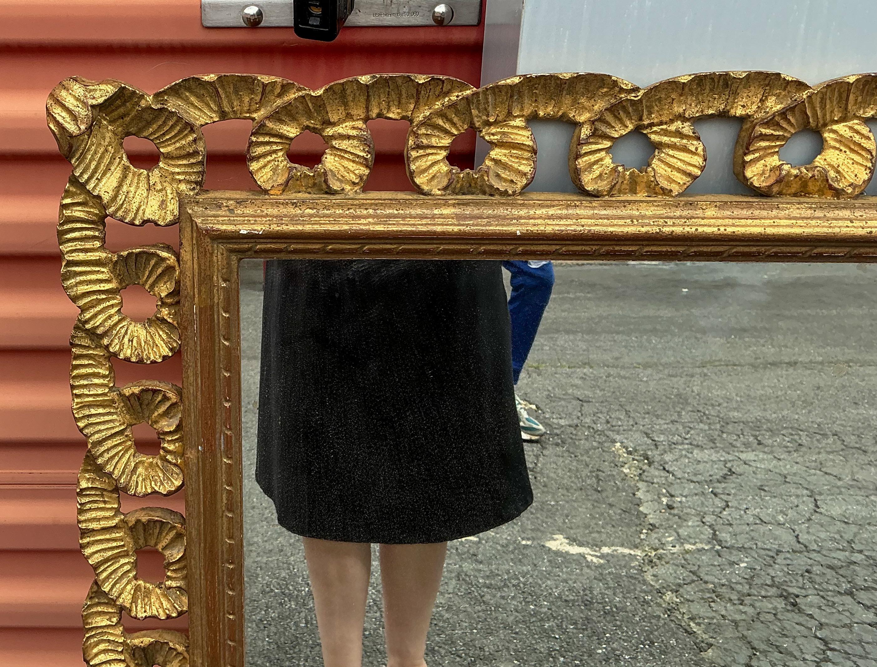 20th Century Mid-Century Italian Hollywood Regency Carved Giltwood Ribbon Wall Mirror For Sale