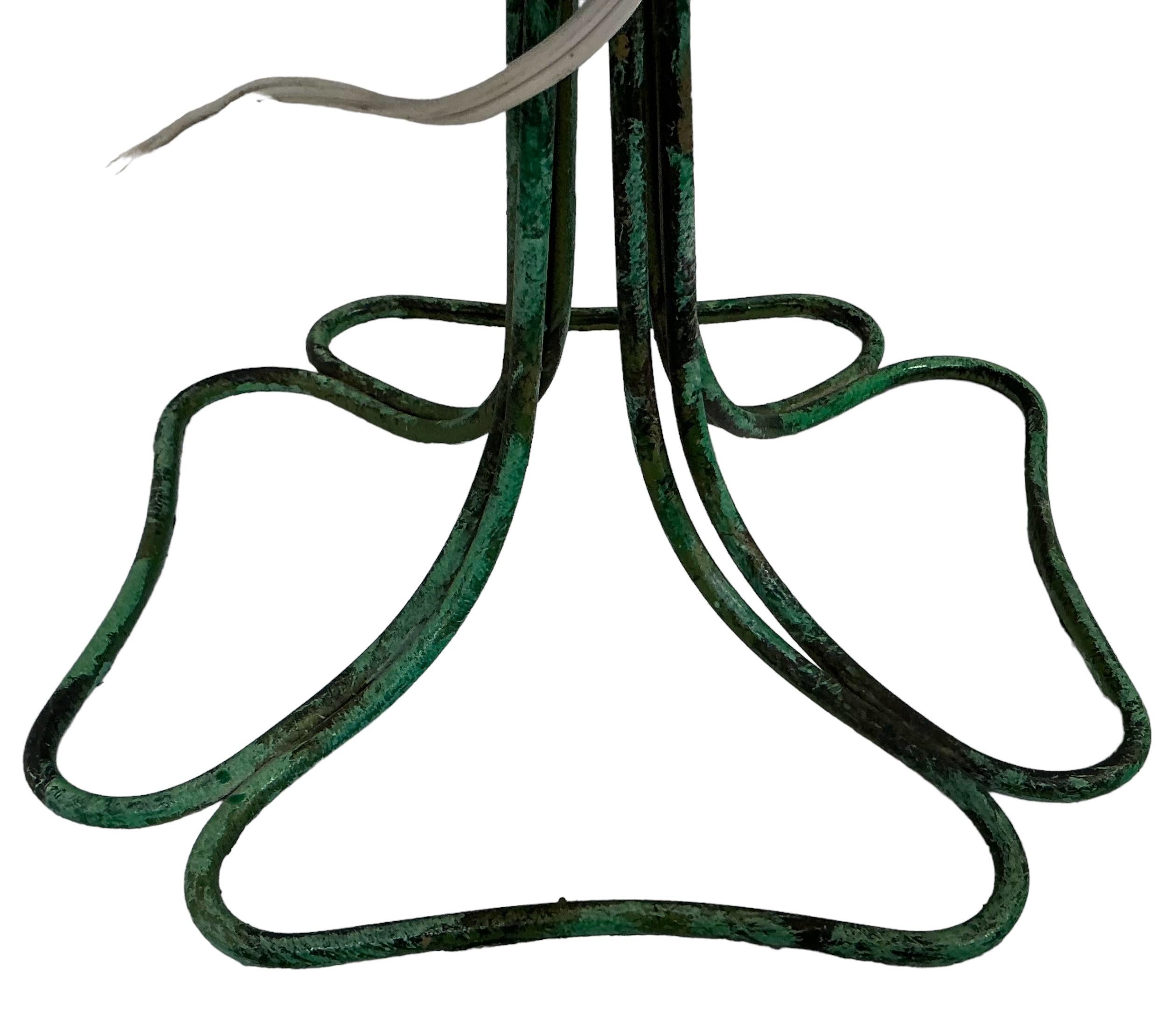 This is a fun Hollywood Regency Italian tole lamp with a grapevine motif. It is green with gilt accents and deep purple / blue grapes. It has a switch on the cord and is in working order. It is marked.