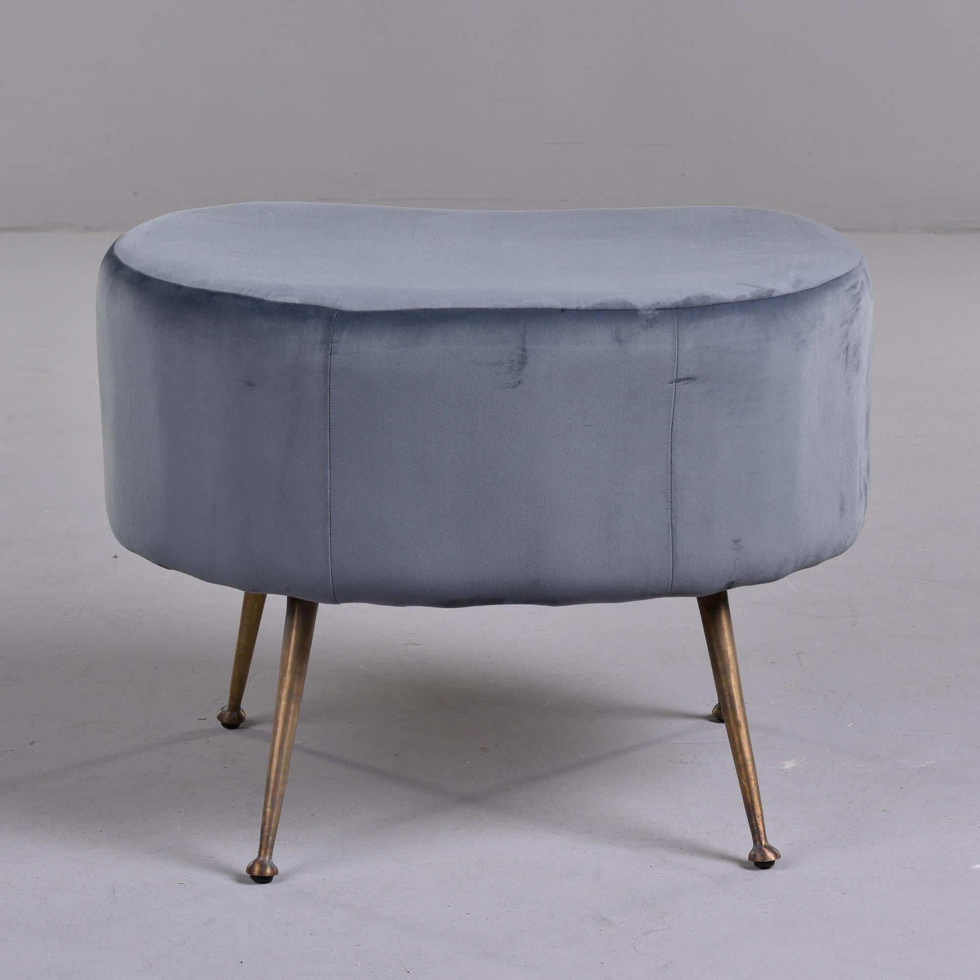 Circa late 1950s / early 1960s Italian kidney shaped stool with slender brass legs and newer pale gray velvet upholstery. Unknown maker. Two stools available at the time of this posting. Sold and priced individually.