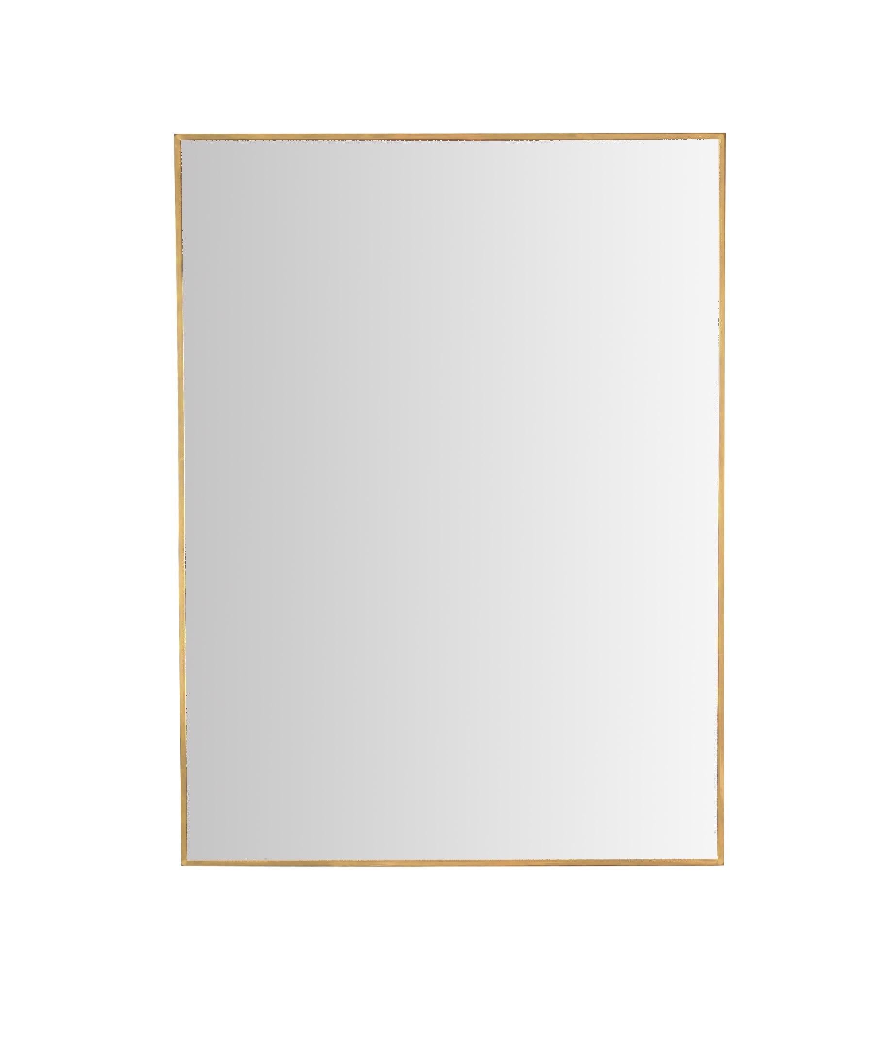 Beautiful large rectangular mirror with a solid brass frame. This elegant mirror was made in Italy during the 1950s.

This beautiful mirror has an rectangular frame made in solid brass, which makes it pretty heavy. The brass has a wonderful golden