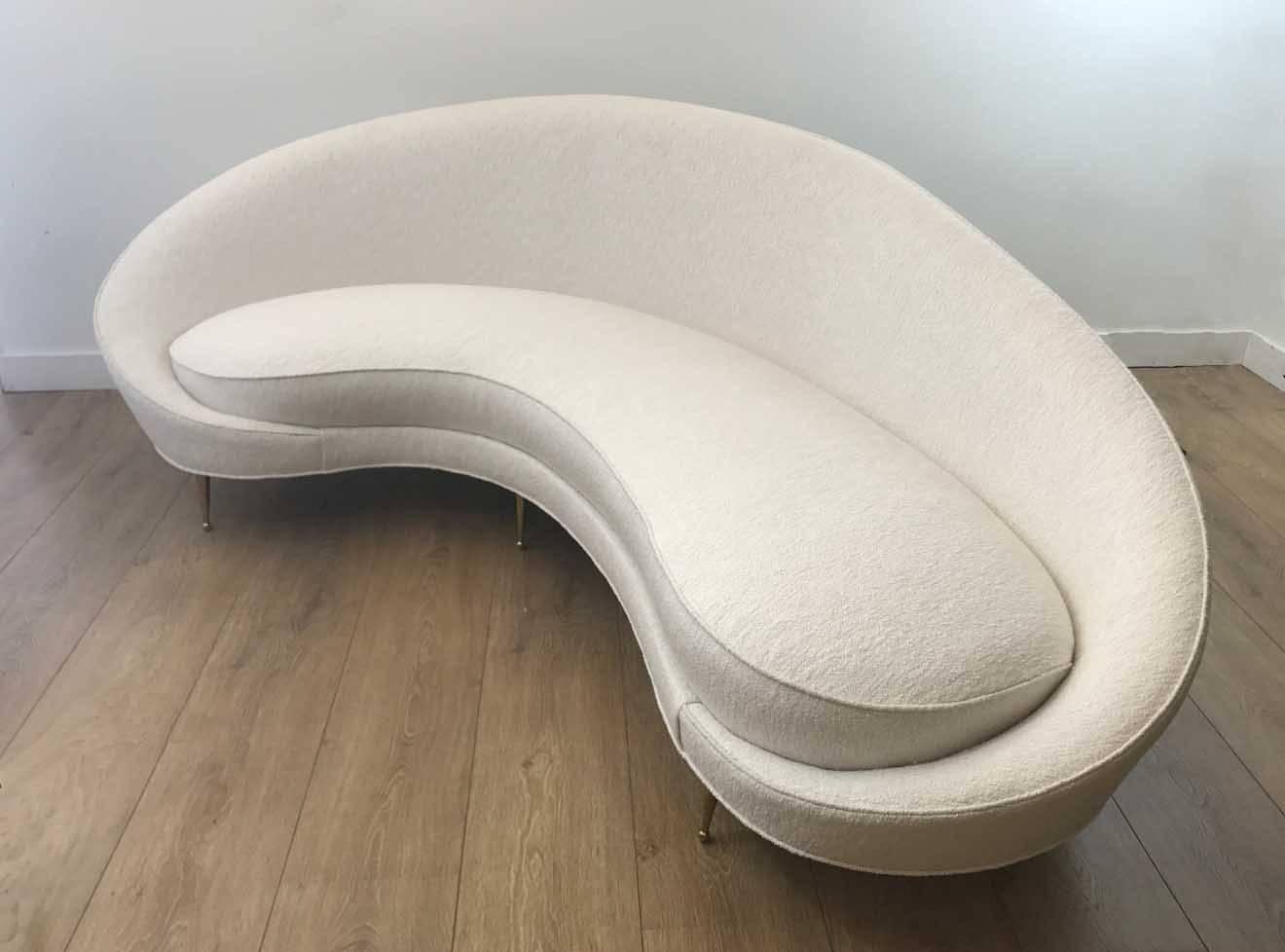 Mid-century modern Italian large kidney shape sofa by Federico Munari. Newly upholstered with pearl white bouclé fabric, brass-plated legs.
Very sensual curves and absolutely comfortable.