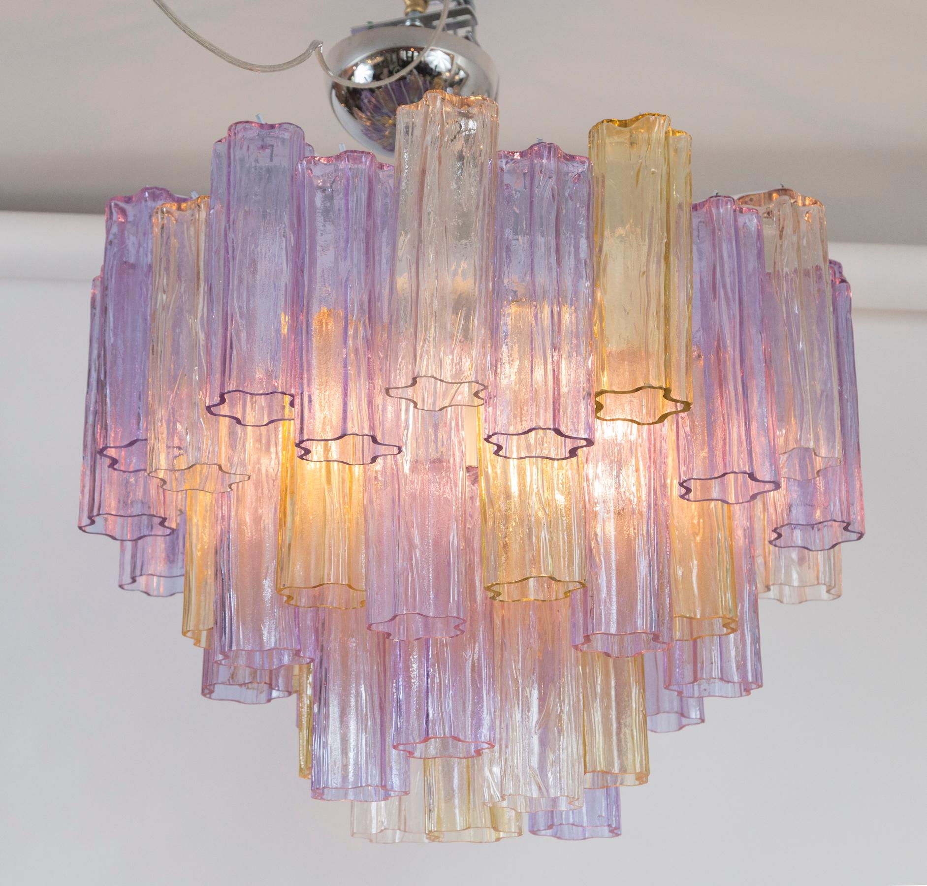 Mid-Century Modern tronchi chandelier or near flush-mount comprised of six graduated layers of lavender, fume and blush  blown colored concentric tubes.
Re-electrified with six medium base sockets for up to 60 watts each of incandescent