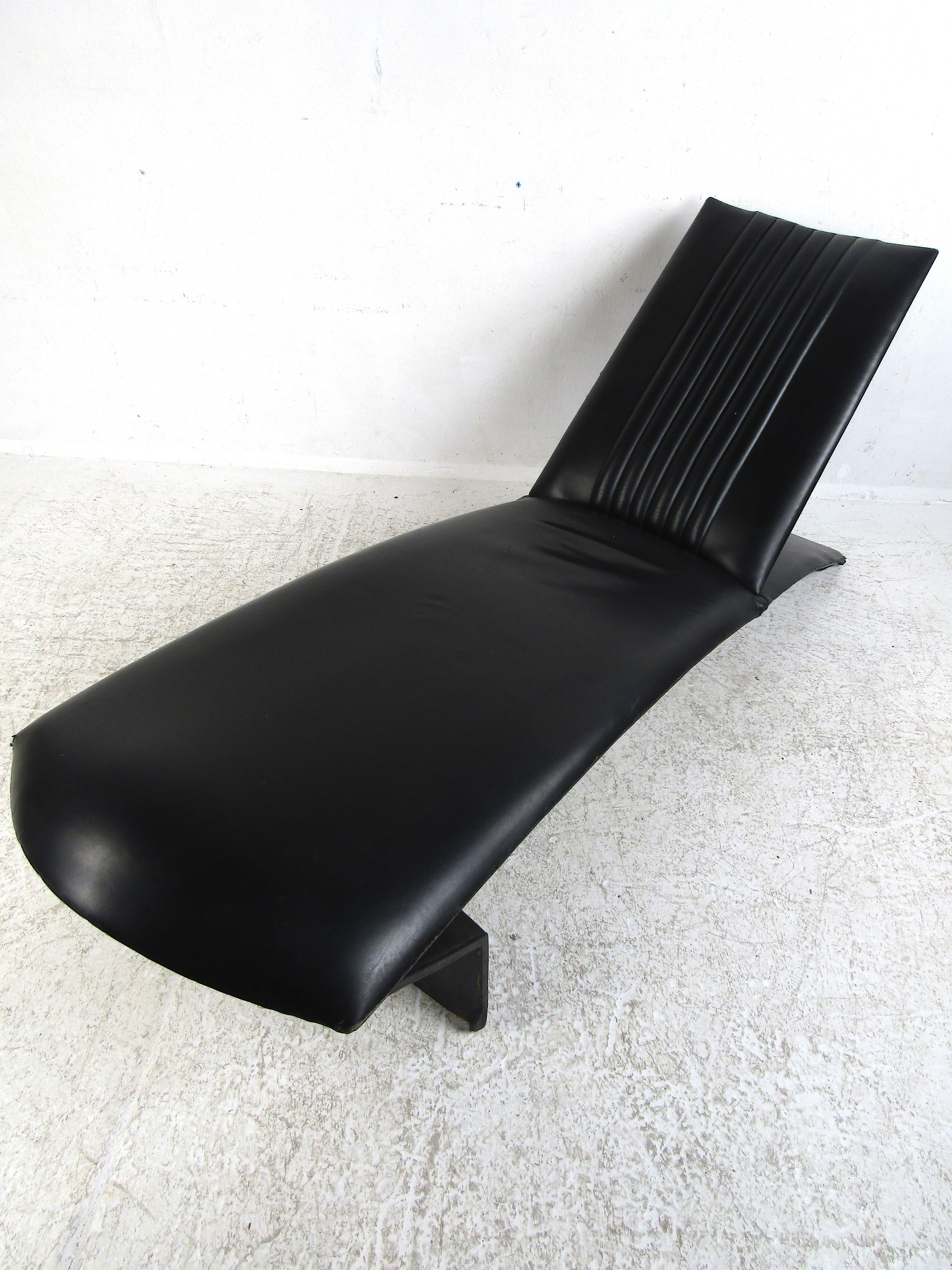 Unique Mid-Century Modern Italian vinyl chaise lounge. Striking angular design with a sloped backrest and form-fitting bed area. Vertical accents on the backrest's upholstery. Please confirm item location with dealer (NJ or NY).