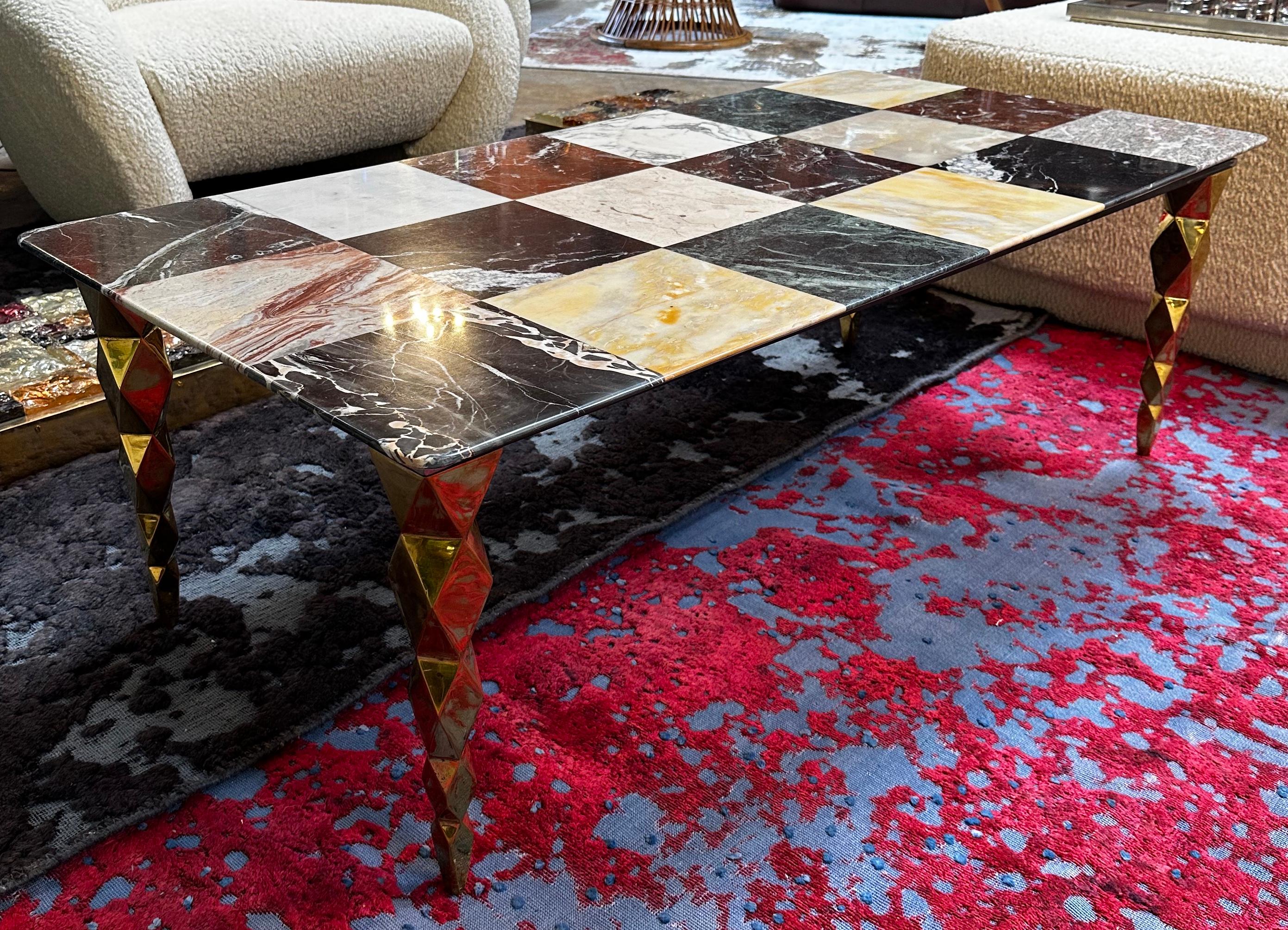 Beautiful Italian coffee table made with brass base and thick marble top. The table is in great conditions and is one of a kind.