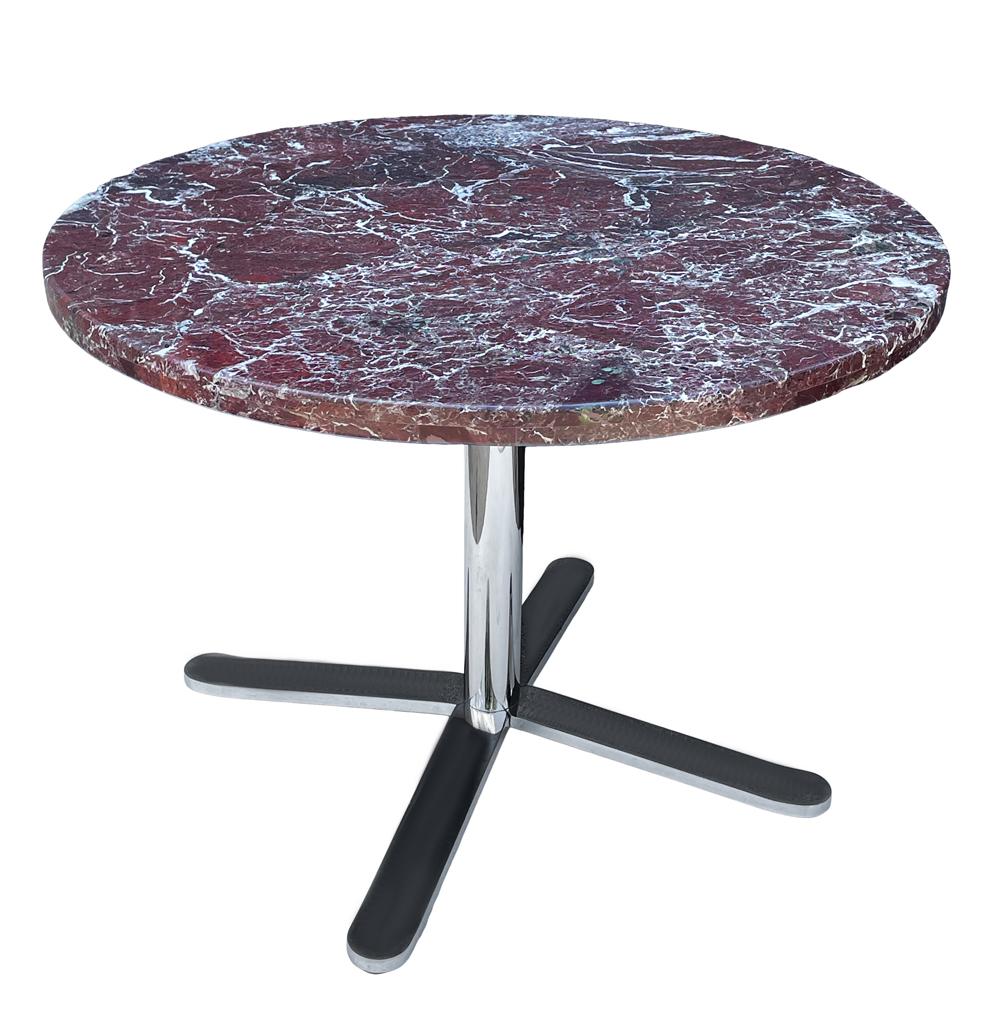 A gorgeous circular dining table with burgundy marble from Italy circa 1970's. It features a four legged chrome plated steel base with thick marble top.
