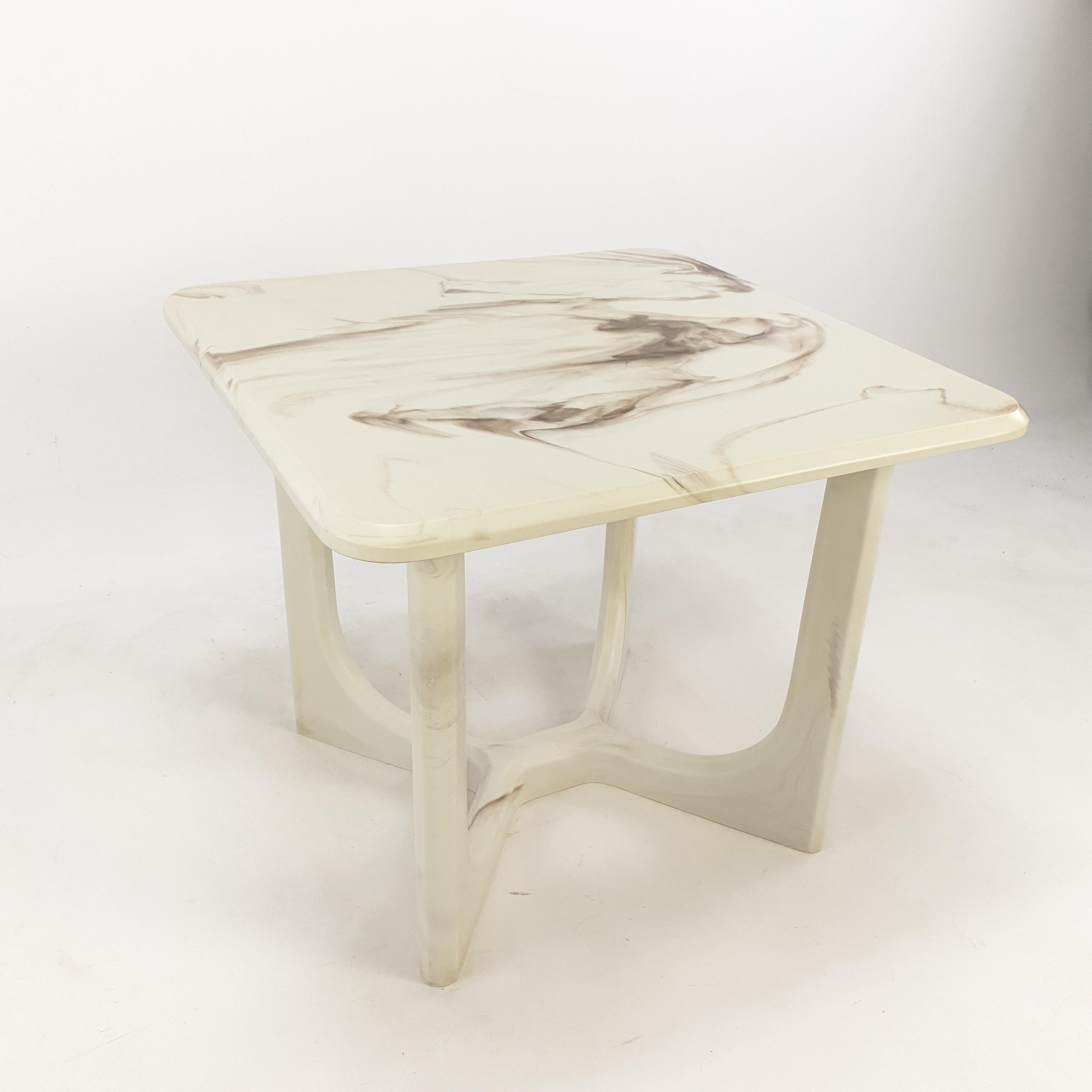 Very nice and rare Italian coffee table of the 50's in Italy. It is made of Marmorino, traditional Venetian polished plaster that look like marble and also has the weight of a marble piece. A very nice plate with a very elegant base.