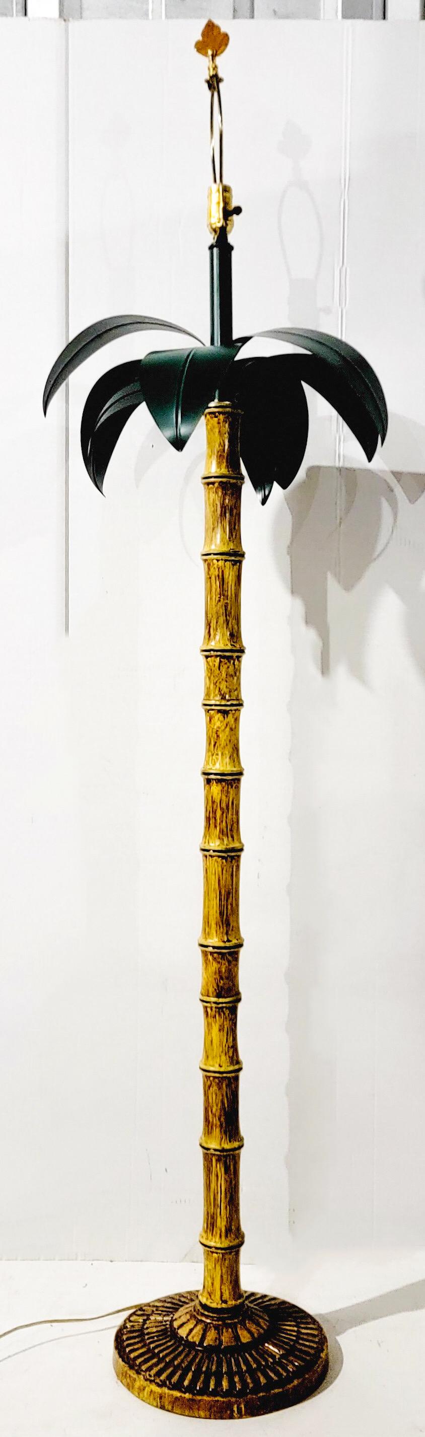 This is a mid-century Italian metal tole palm leaf and faux bamboo floor lamp in very good condition. The socket is newer, and it is UL listed. Base is 10.5”D. Height with harp is 67”.