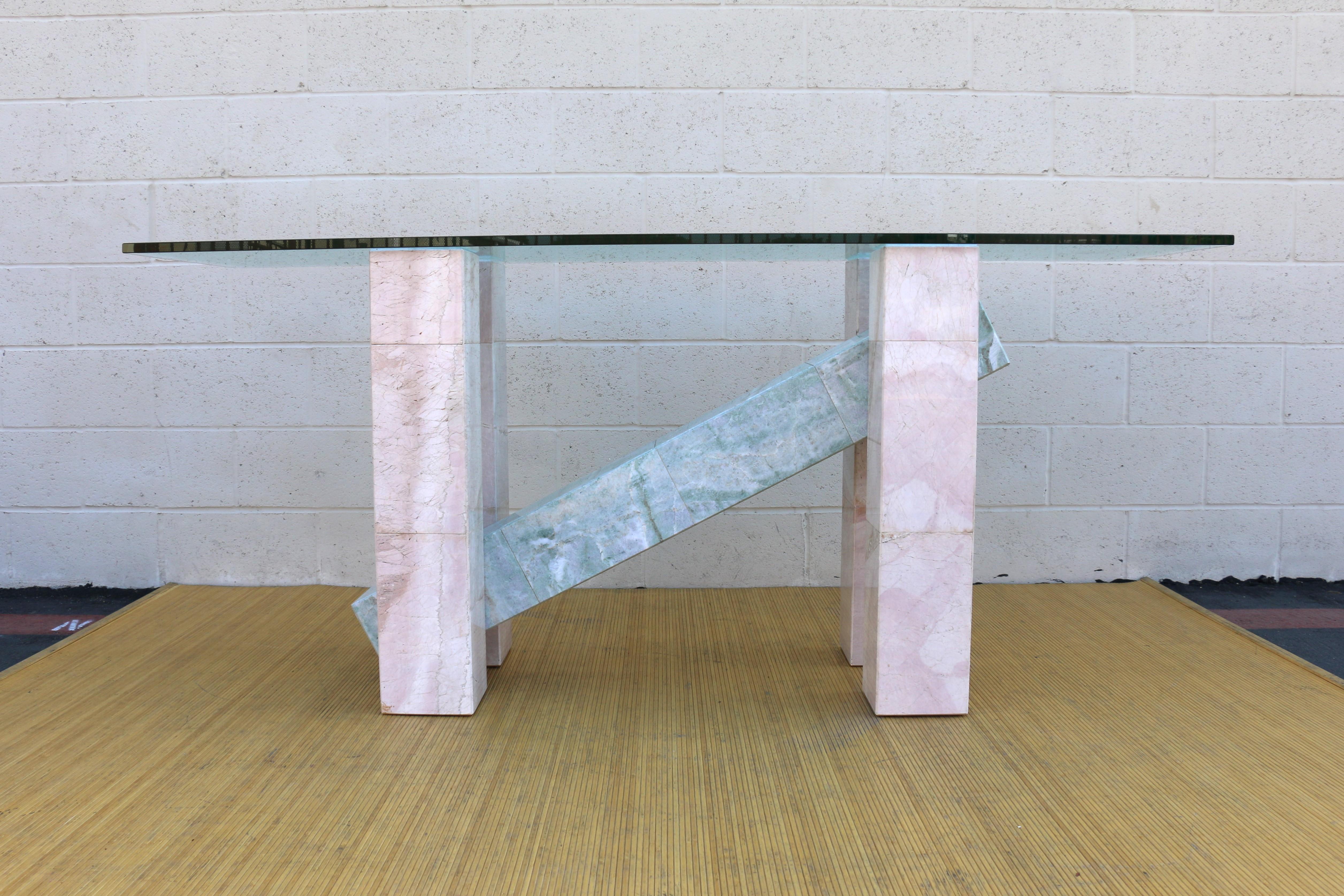 Wonderful Italian console table made of marble and glass top. This table is originally from the 1970’s. It is in good condition. It has no chips no damages. The design is absolutely beautiful and the colors are so vibrant that it makes it stand out