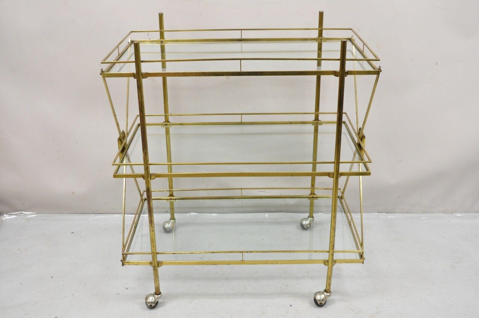 Mid Century Italian Modern 3 Tier Brass & Glass X-Frame Rolling Server Bar Cart. Circa  Mid 20th Century. Measurements: 41