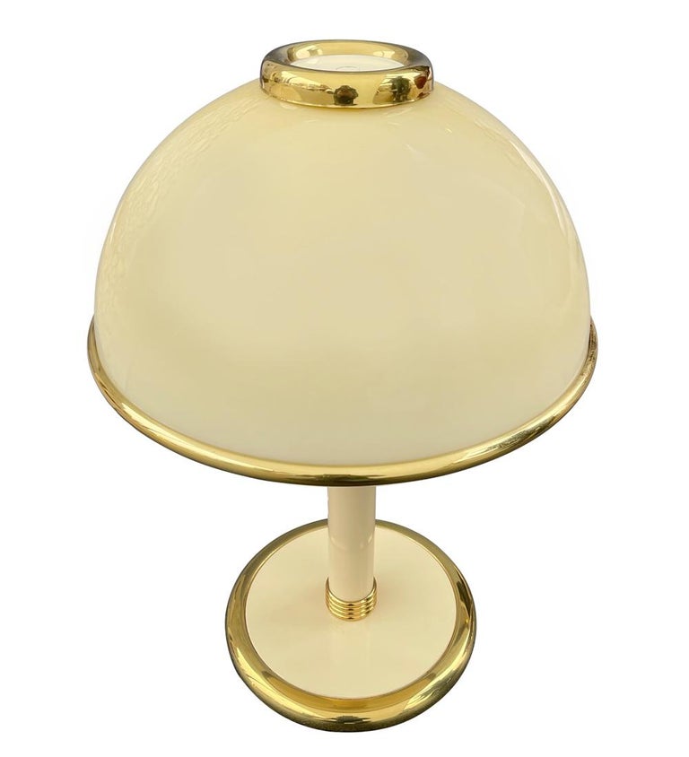 Glass art lamp with tan Mazzega glass in a mushroom form. It features brass trim detailing. Wiring is excellent and fully working.