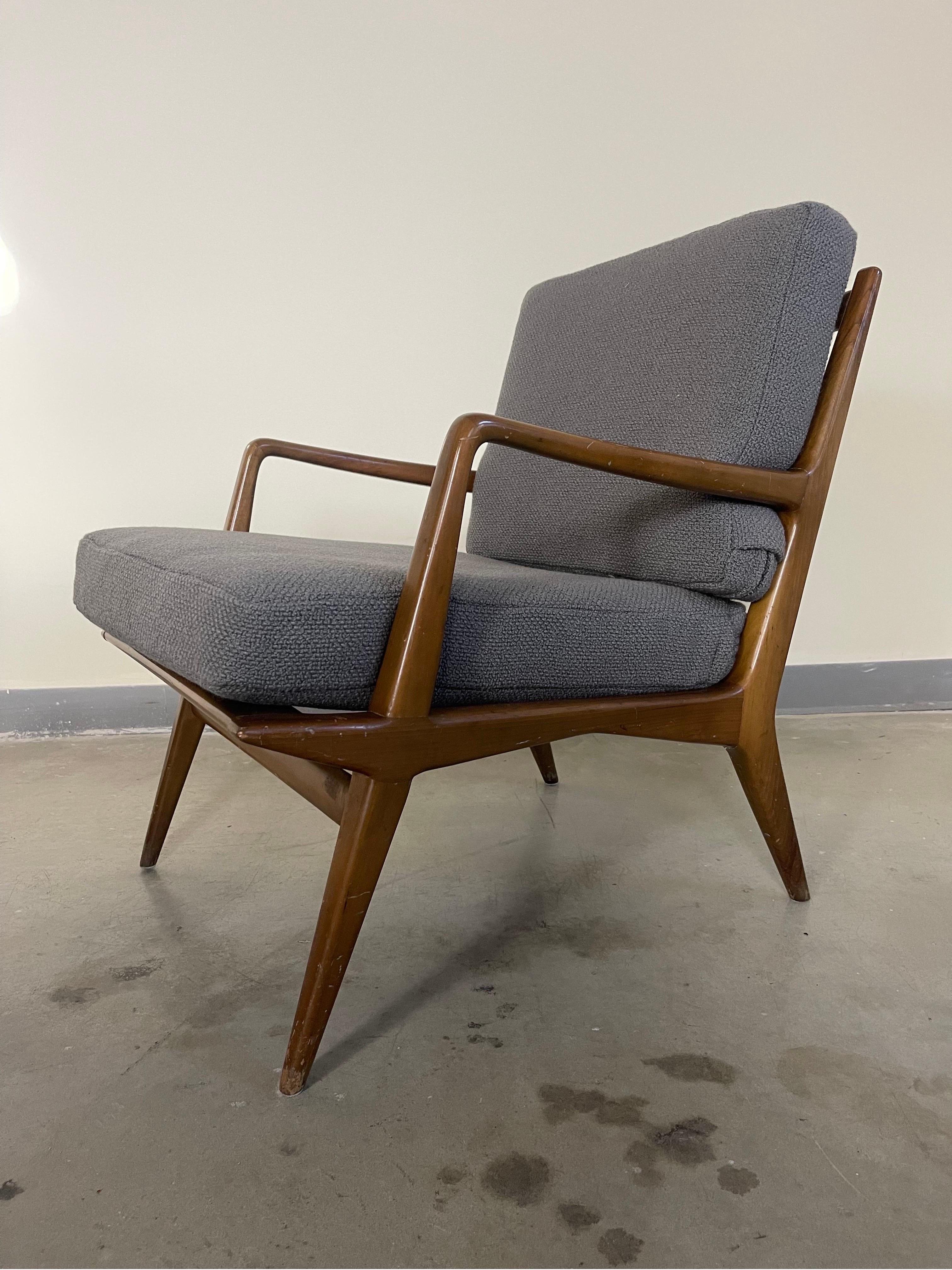Mid-Century Modern chair designed by Carlo De Carli for Singer and Sons. New high end wool boucle upholstery. Frame is original and unrestored- marks and wear are commensurate with age.