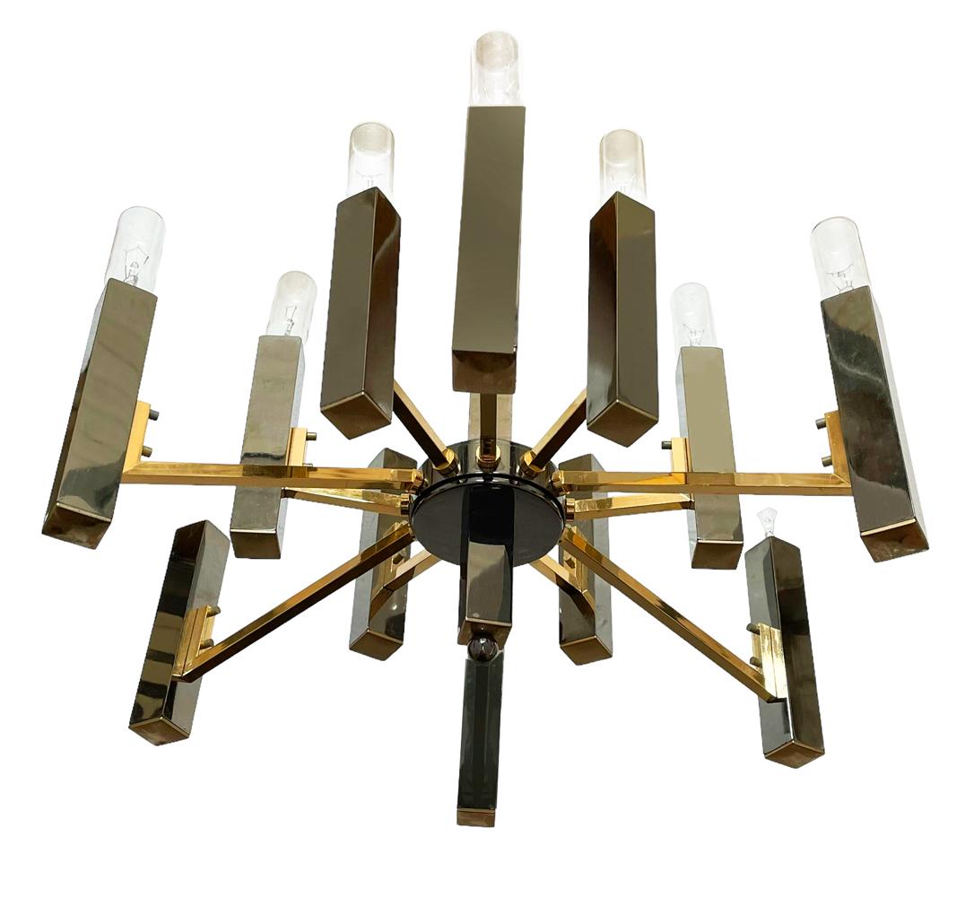 A classy looking chandelier by Sciolari from Italy circa 70's or 80's. It features gunmetal chrome and brass construction. 12 bulbs and 15 inch hanging chain included. Original bulbs and extra bulbs included. 