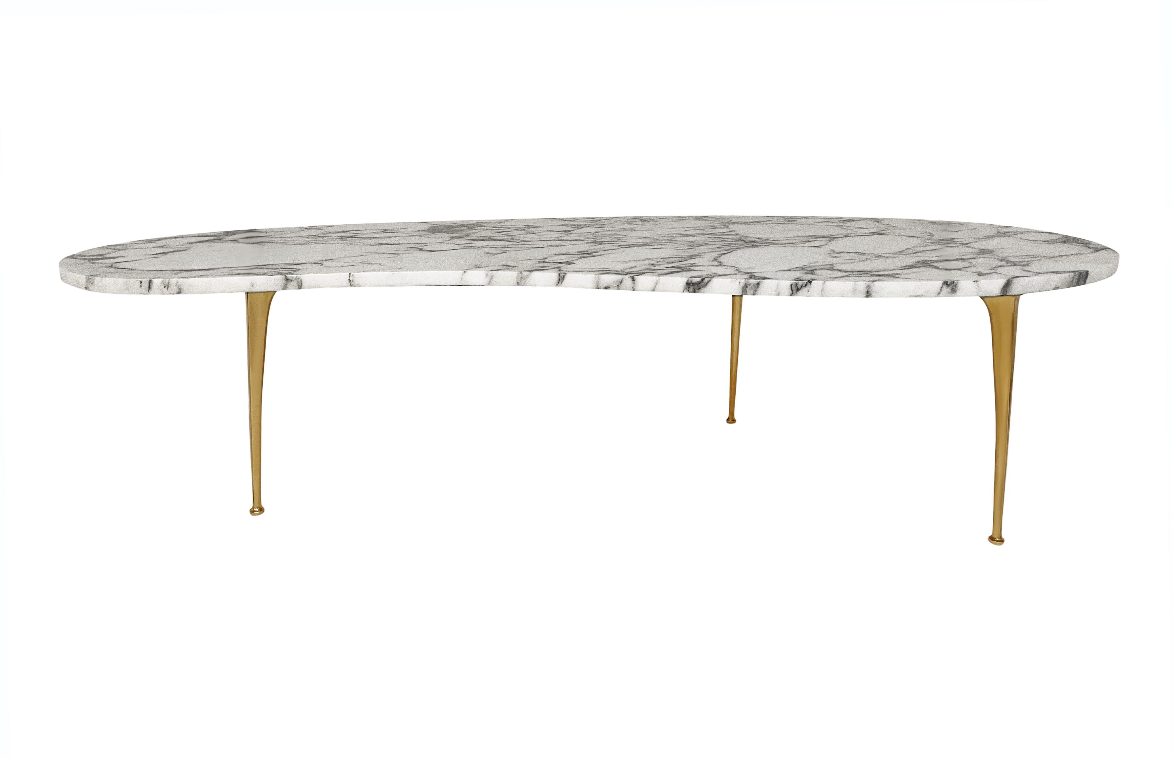 A stunning Italian coffee table from Italy circa 1960's. It features an elongated kidney shape top in Arabescato marble, with sexy brass stiletto legs.