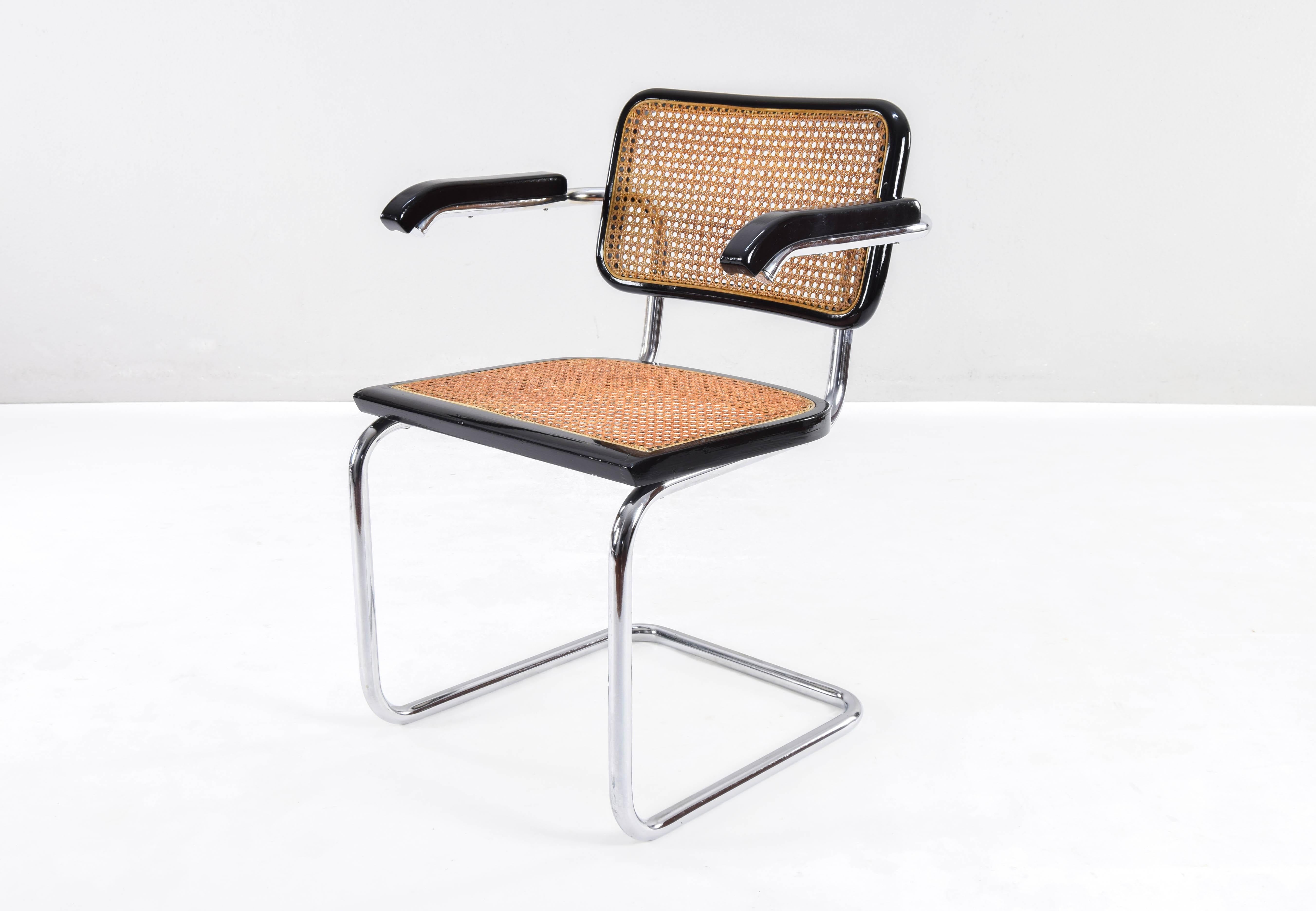 Cesca armchair model B64, Italy in the 1970s. This chair are part of a high quality edition.

Chrome tubular structure in good condition. Beech wood frames lacquered in black and Viennese natural grid. The natural fiber grille of the seat have
