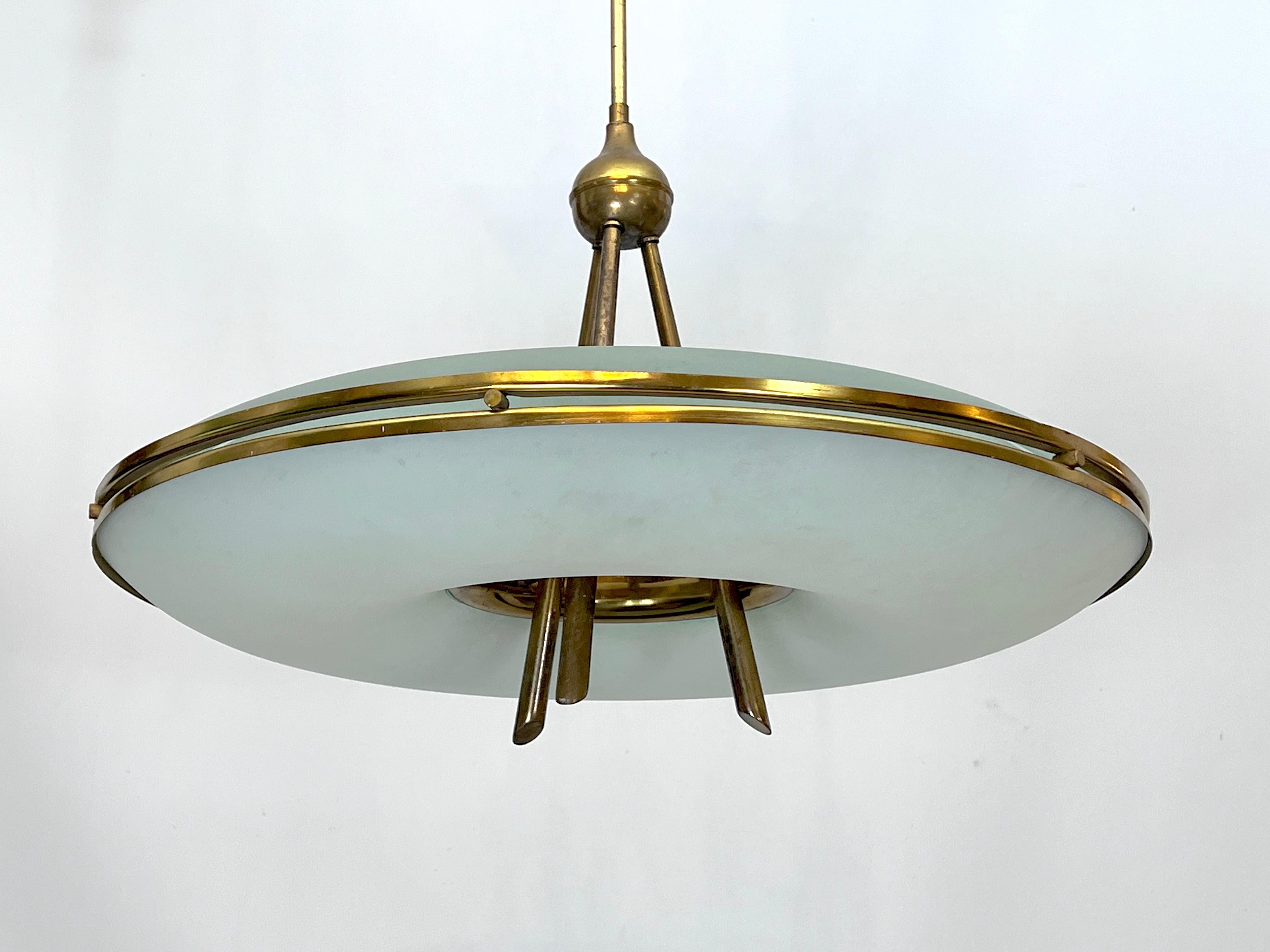 Produced in Italy during the 50s, this round chandelier with double curved satin glasses was designed in the style of Max Ingrand for Fontana Arte. It is in fair vintage condition with original patina and trace of age and use. No cracks or chips but