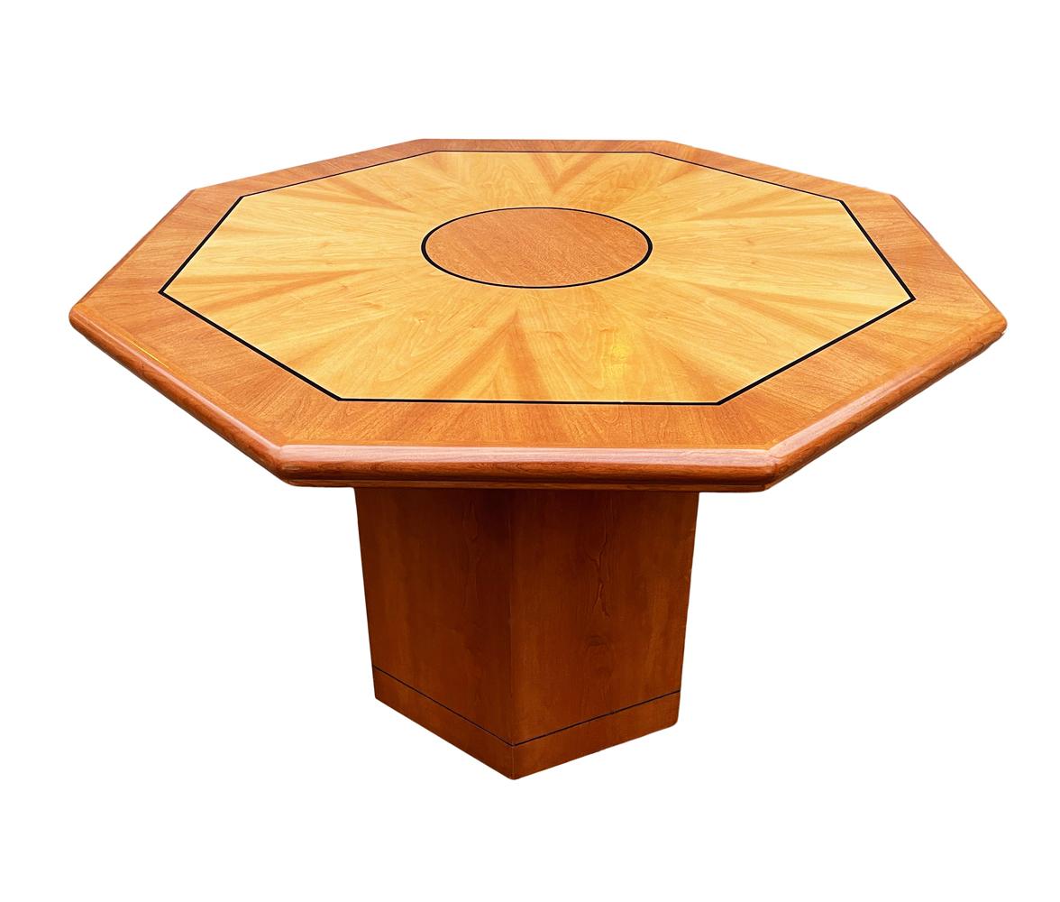 A gorgeous well made table with many possible uses. The table features a geometric design with exotic wood veneers.