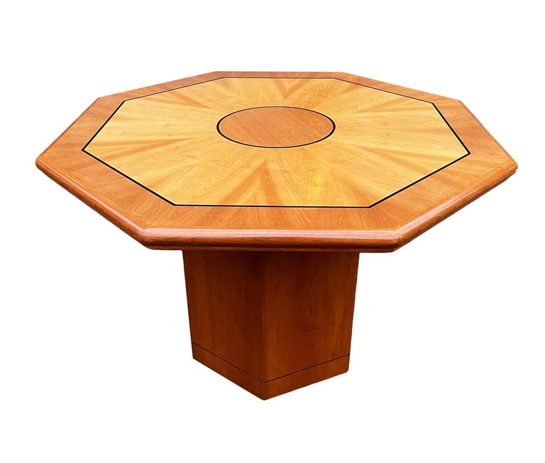 A gorgeous well made table with many possible uses. The table features a geometric design with exotic wood veneers.
