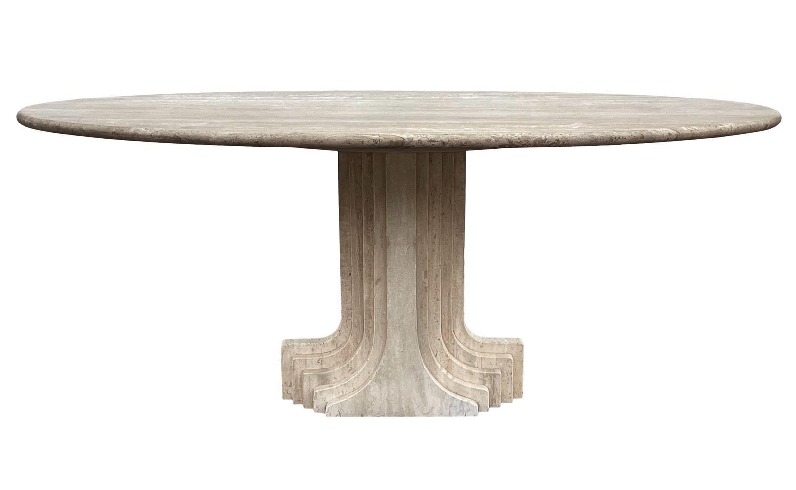 A stunning design oval dining table by Carlo Scarpa and produced by Simon Gavina in Italy circa 1975. It features beautiful solid cream colored travertine construction. Well cared for without any condition issues.
