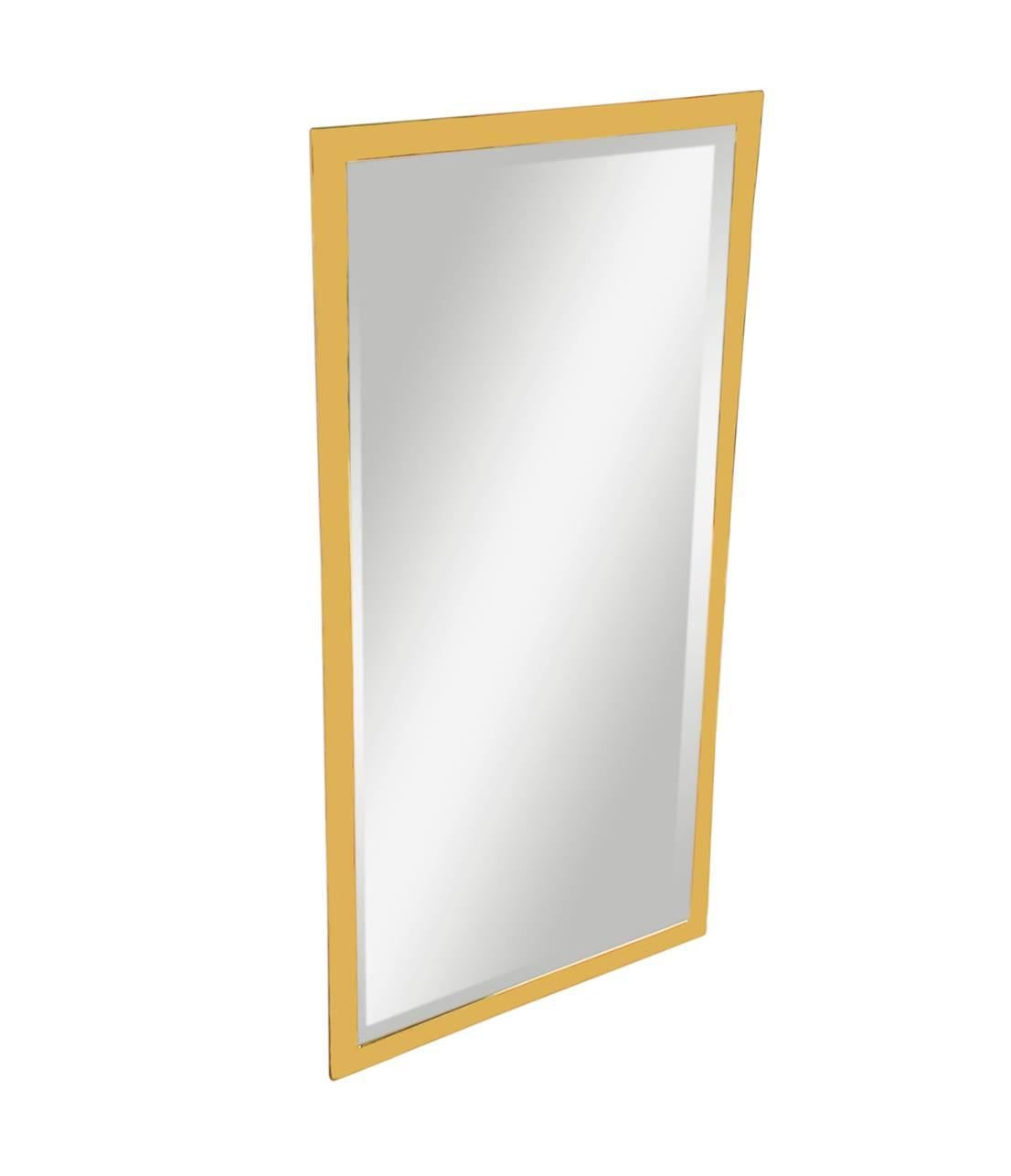 A well made, simple, and modern brass framed wall mirror made in Italy, circa 1970s. It features a heavy brass frame with inlaid beveled mirror.