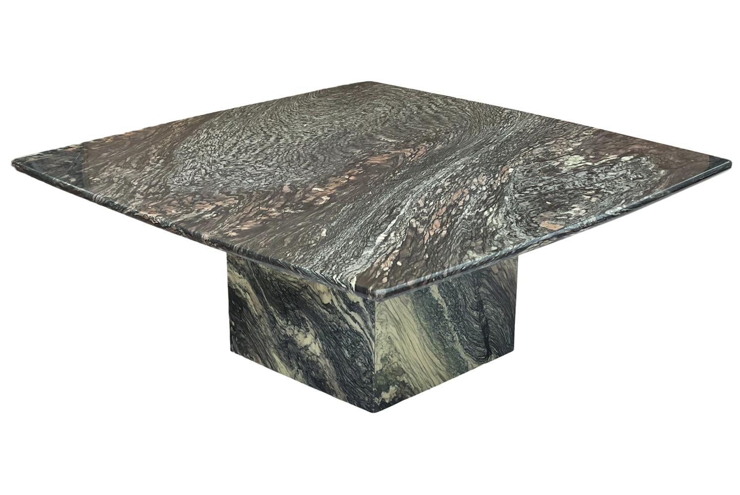 A stunning marble coffee table from Italy circa 1990's. It consists of all marble slab construction with beautiful veining.