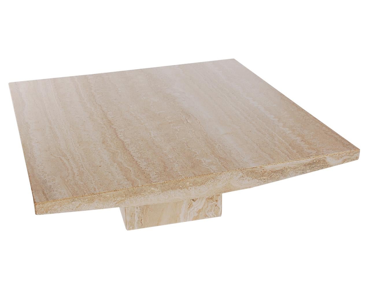 A simple and stunning coffee table from Italy circa 1970s. This table is constructed of thick slabs of travertine. Very clean and ready for immediate use.