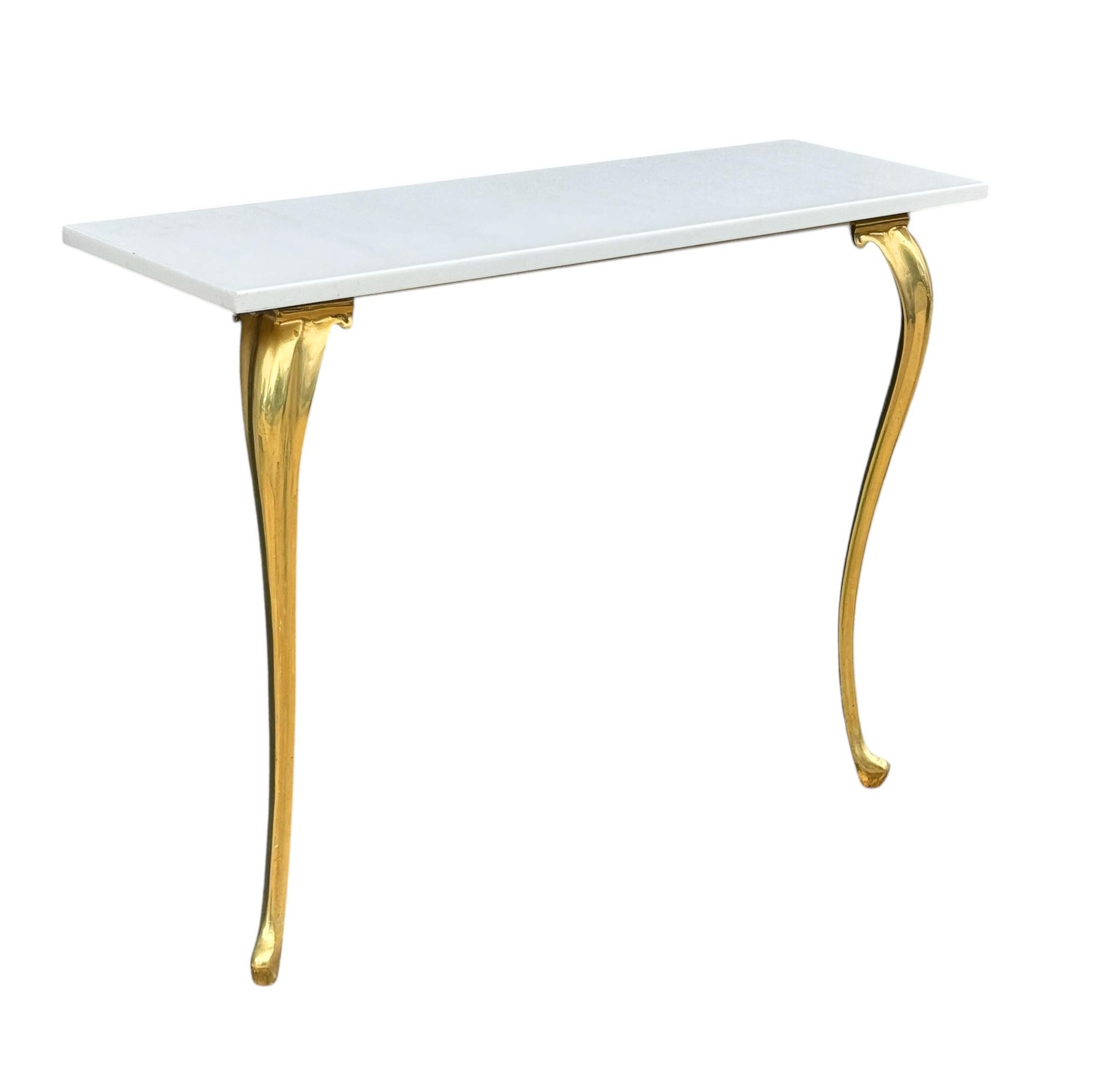 A stunning and simple modern console table from Italy circa 1960's. Beautiful pure white marble with curvy brass legs. 
