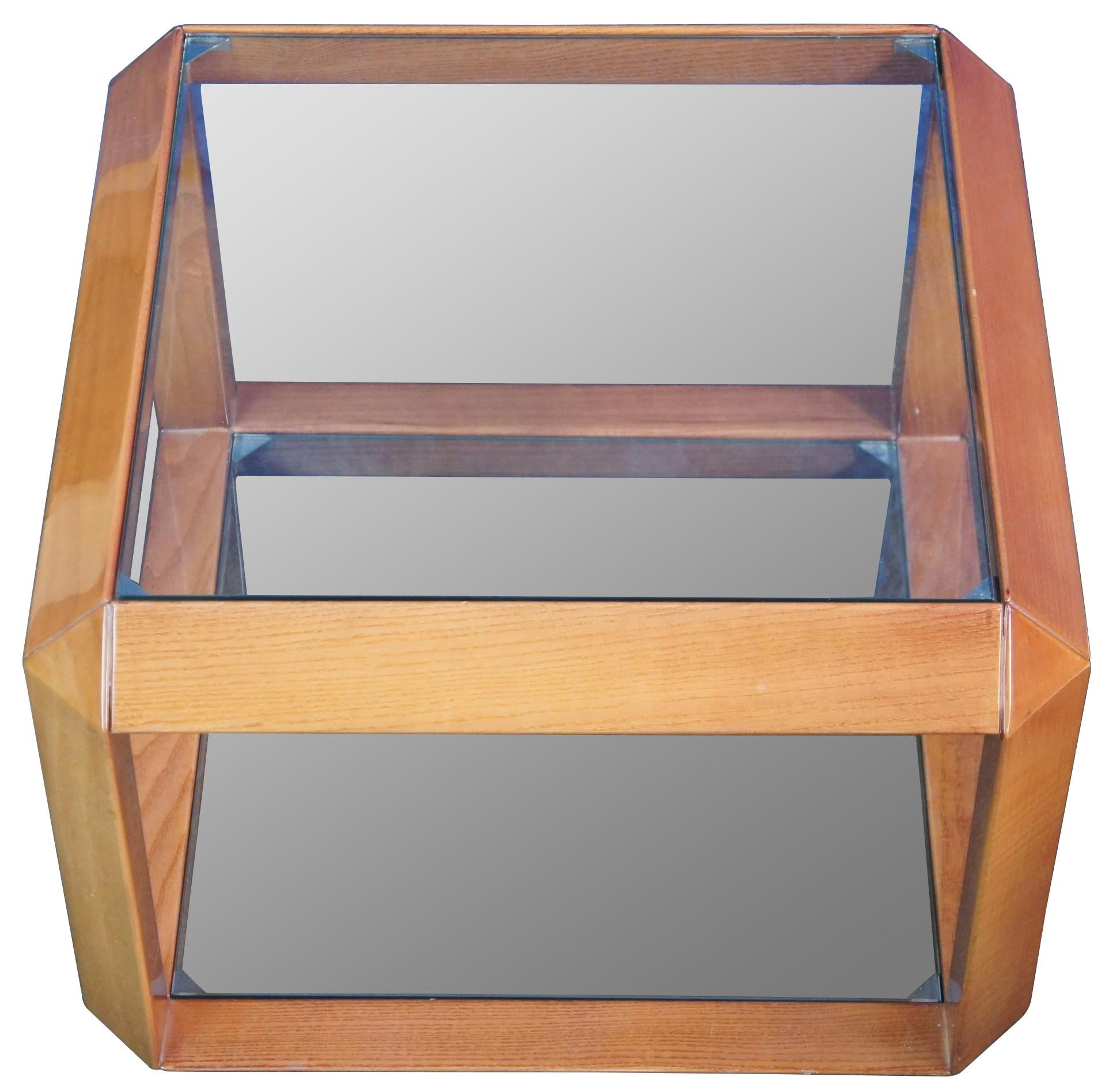Circa 1970s high gloss cube table. Made from wood with two glass shelves.

Provenance: Jerome Schottenstein Estate, Columbus Ohio. Jerome was an American entrepreneur and philanthropist, co-founder of Schottenstein Stores Corp. The Schottenstein