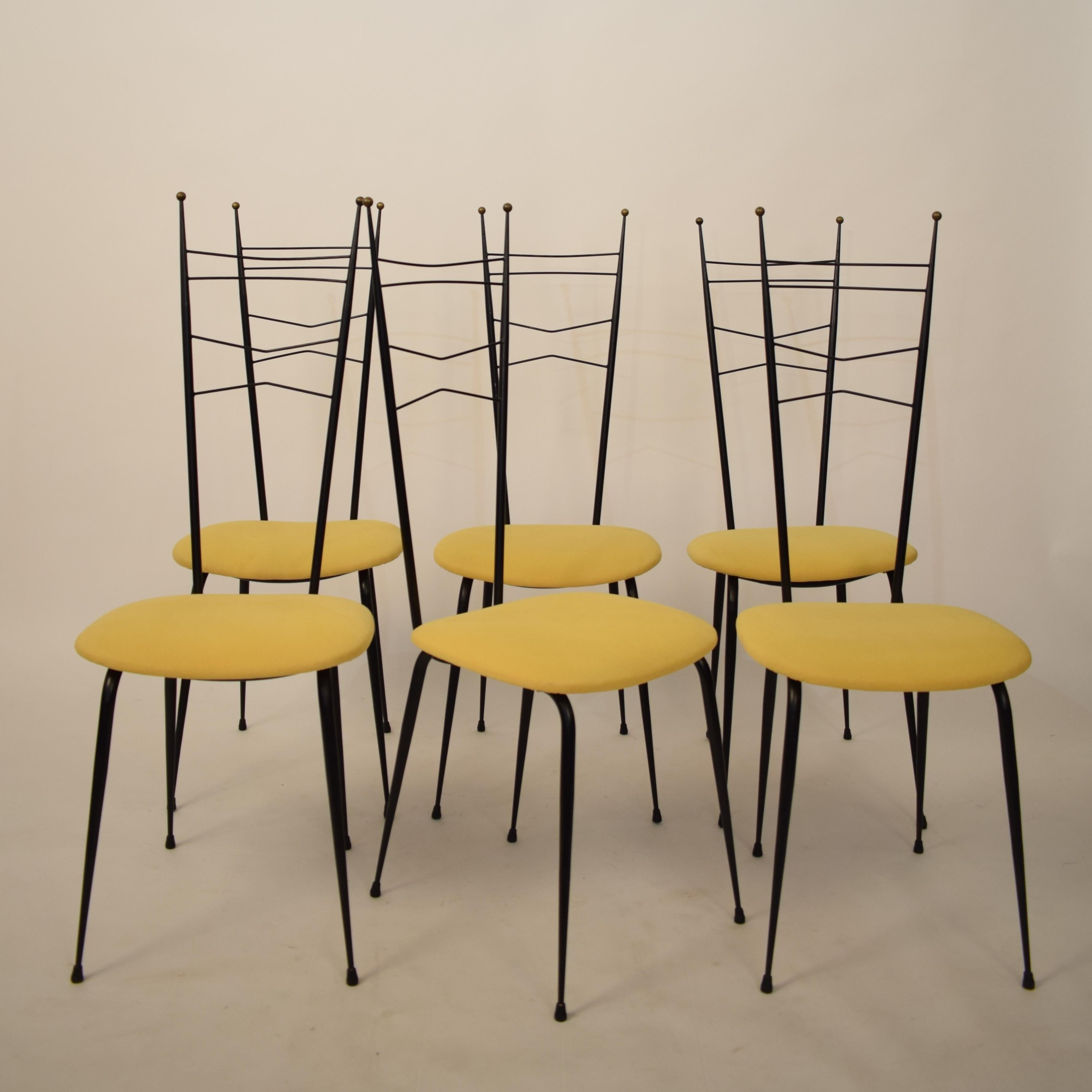 This extraordinary midcentury Italian multi-color dining room set attributed to Ico Parisi and Paolo di Poli.
It is made out of black lacquered metal, Formica, brass and enameled copper.
It is in beautiful untouched original condition and I bought