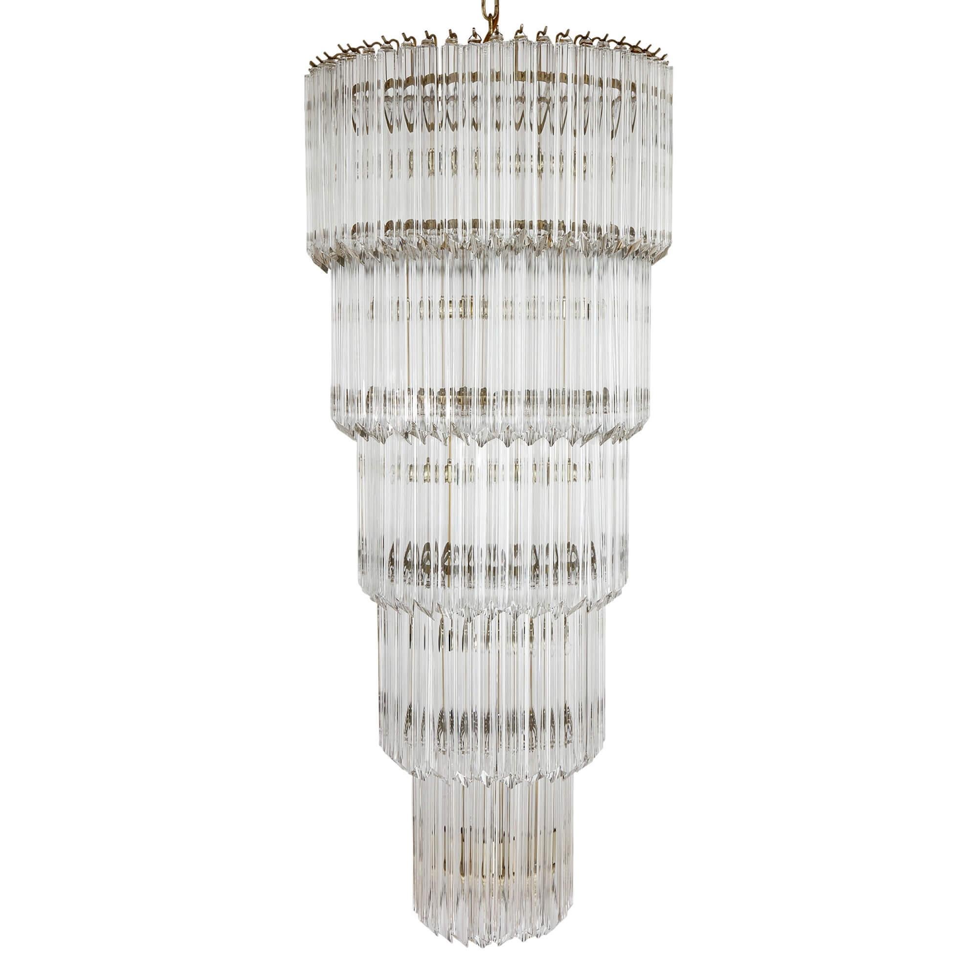 Midcentury Italian Murano glass and ormolu chandelier 
Italian, Mid-20th century 
Height 126cm, diameter 56cm

This stunning Murano glass and ormolu chandelier has been produced by Camer. It is an exquisite example of Italian midcentury design