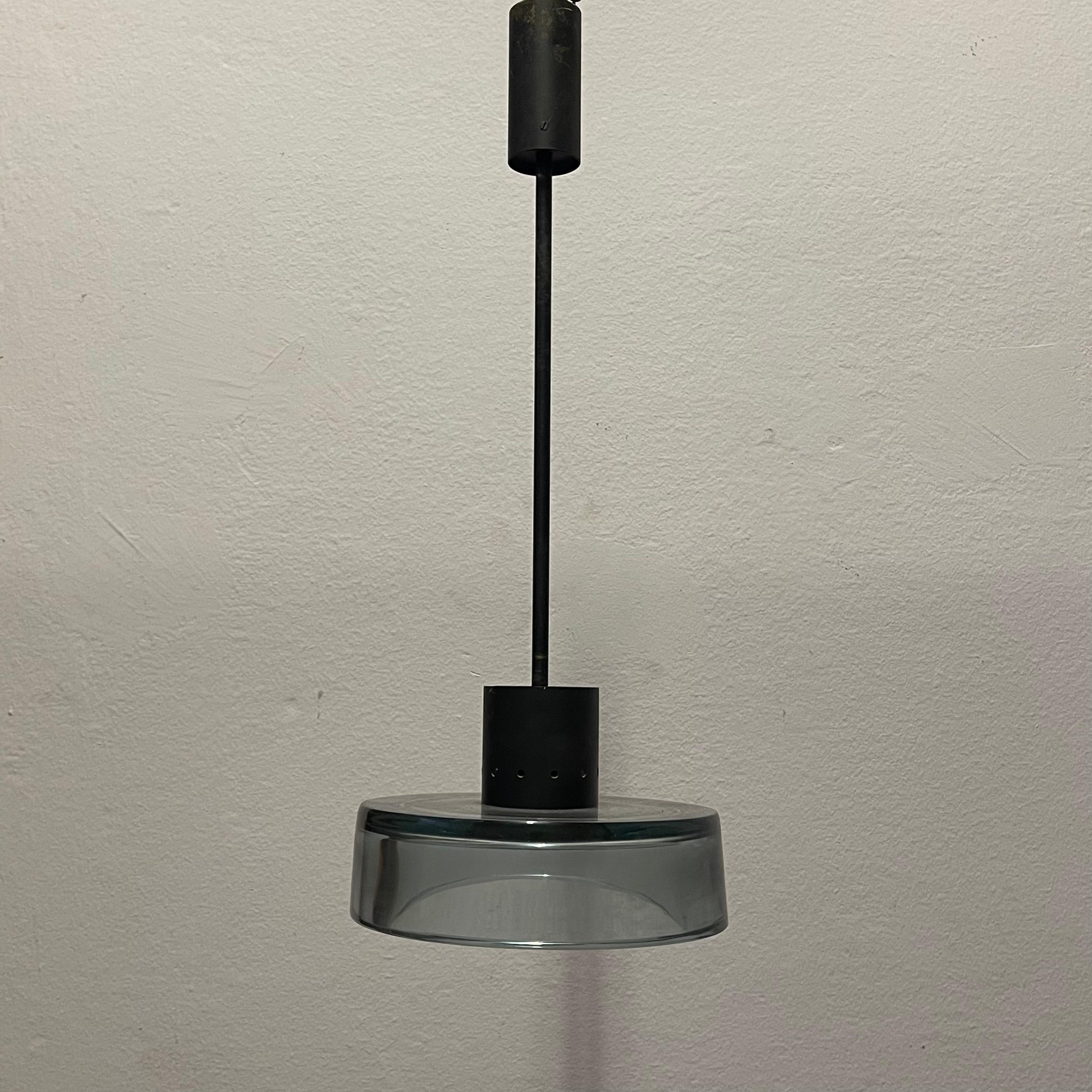Mid-Century chandelier made of thick (27mm) aquamarine Murano glass and matte black metal by Flavio Poli for Seguso, 1960s Chandelier or pendant lamp, consisting of a cylindrical lamp holder made of matte black metal, with a round-shaped double